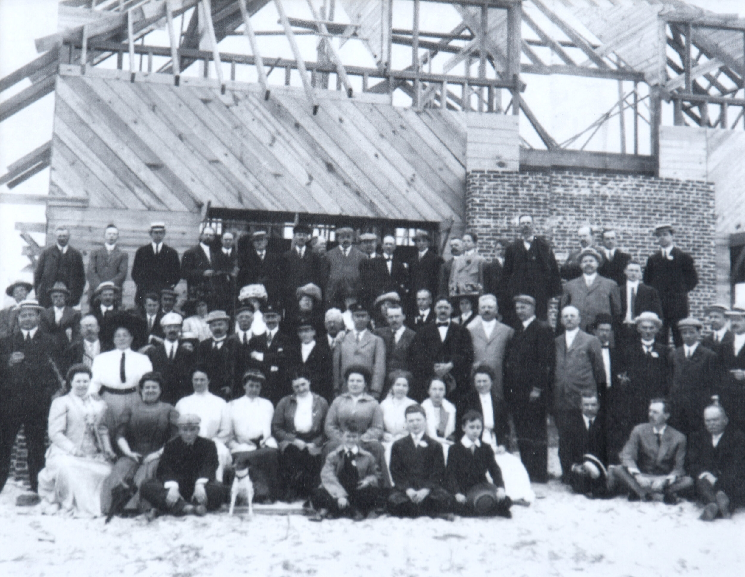 Members in front of the club building while it is under construction, circa 1911.