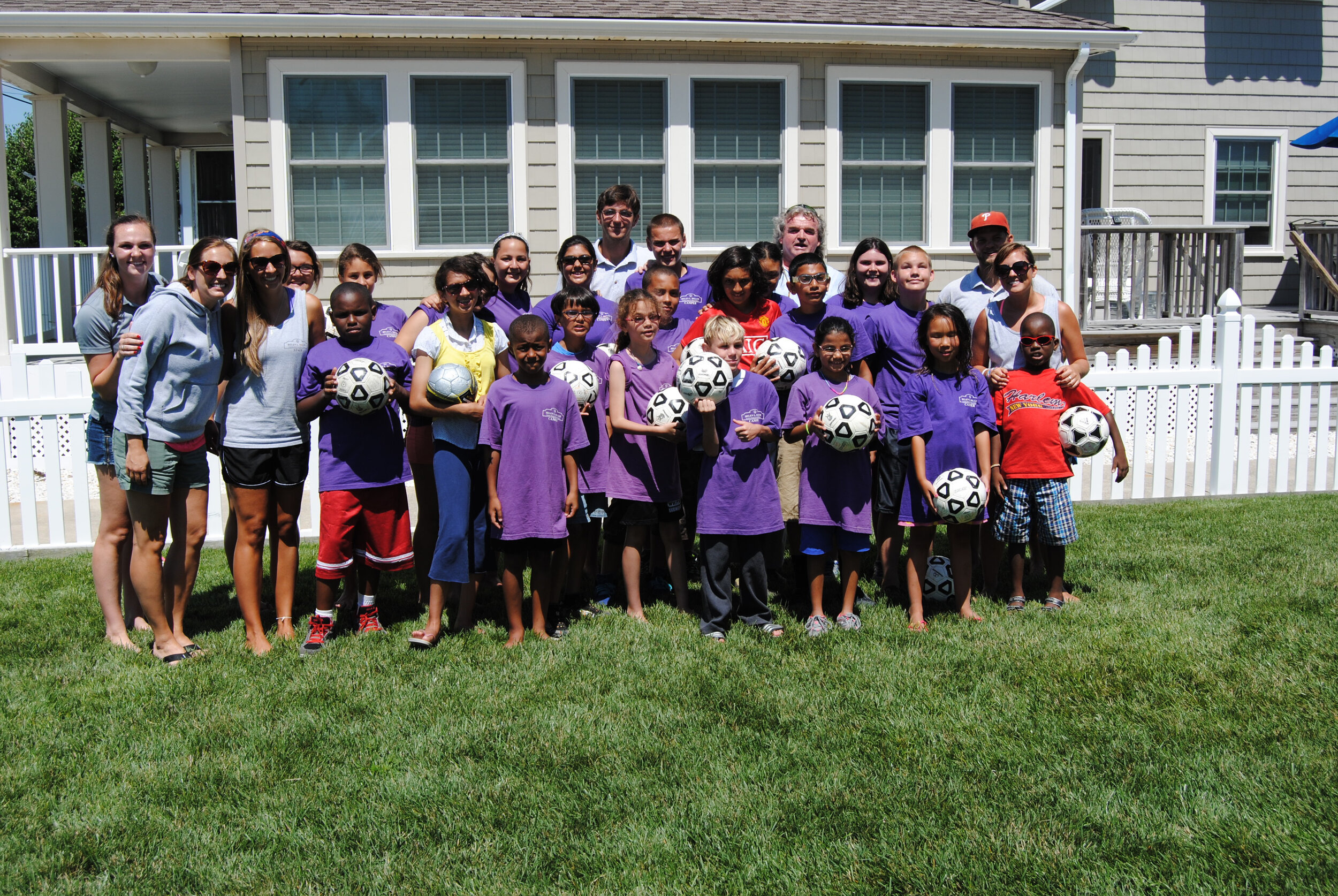 Kevin MacFarlane poses with campers and counselors after giving a  soccer clinic at the Helen L. Diller Vacation Home for Blind Children in 2014.