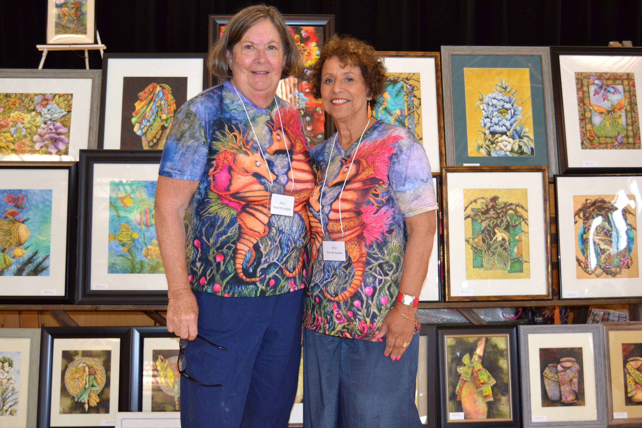 APAC chairperson Susan MacLaughlin (left) and  president Ramona Sanabria at the Art Show.