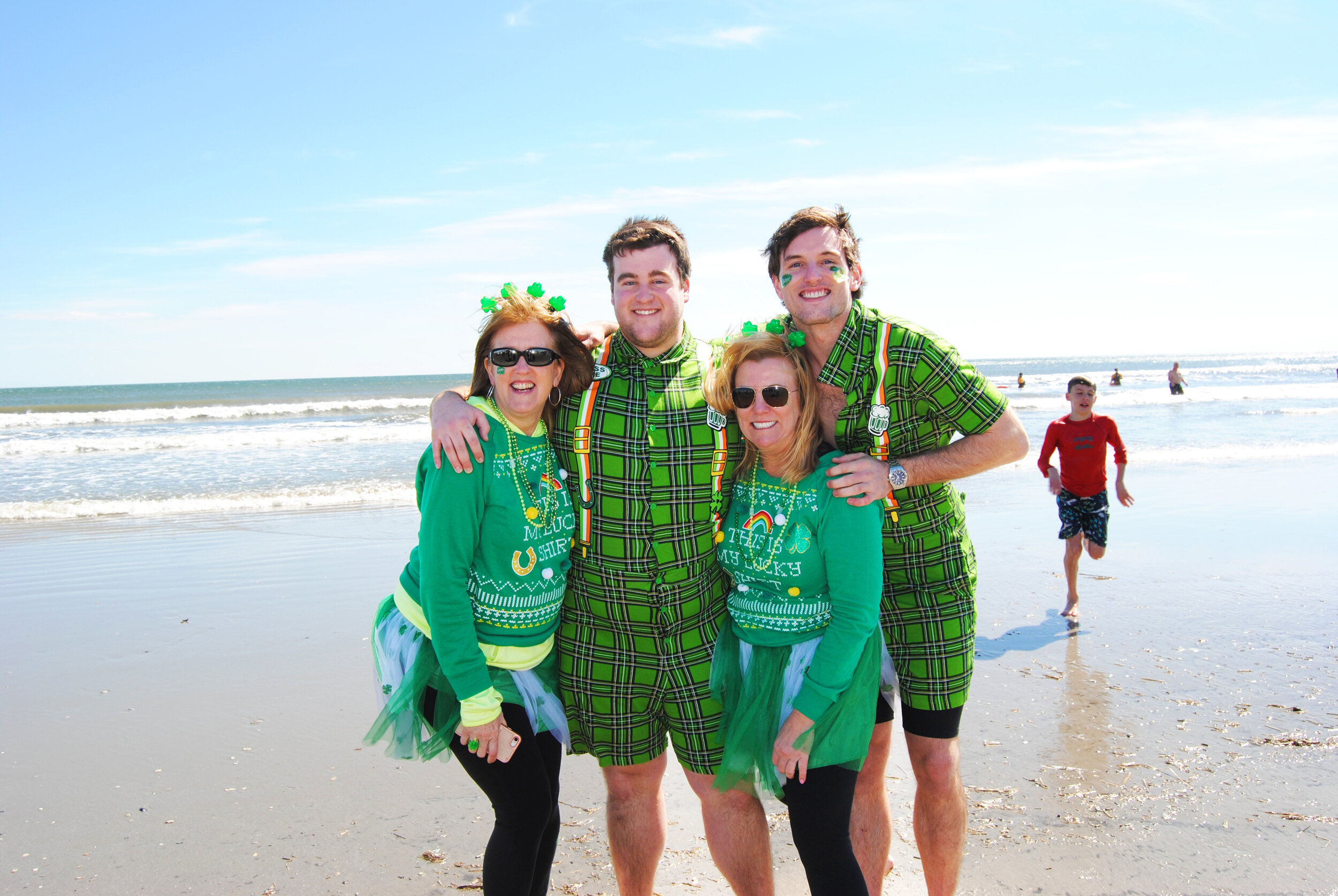 Lisa, Eileen, Max and Noah Robb pose before jumping into the ocean.