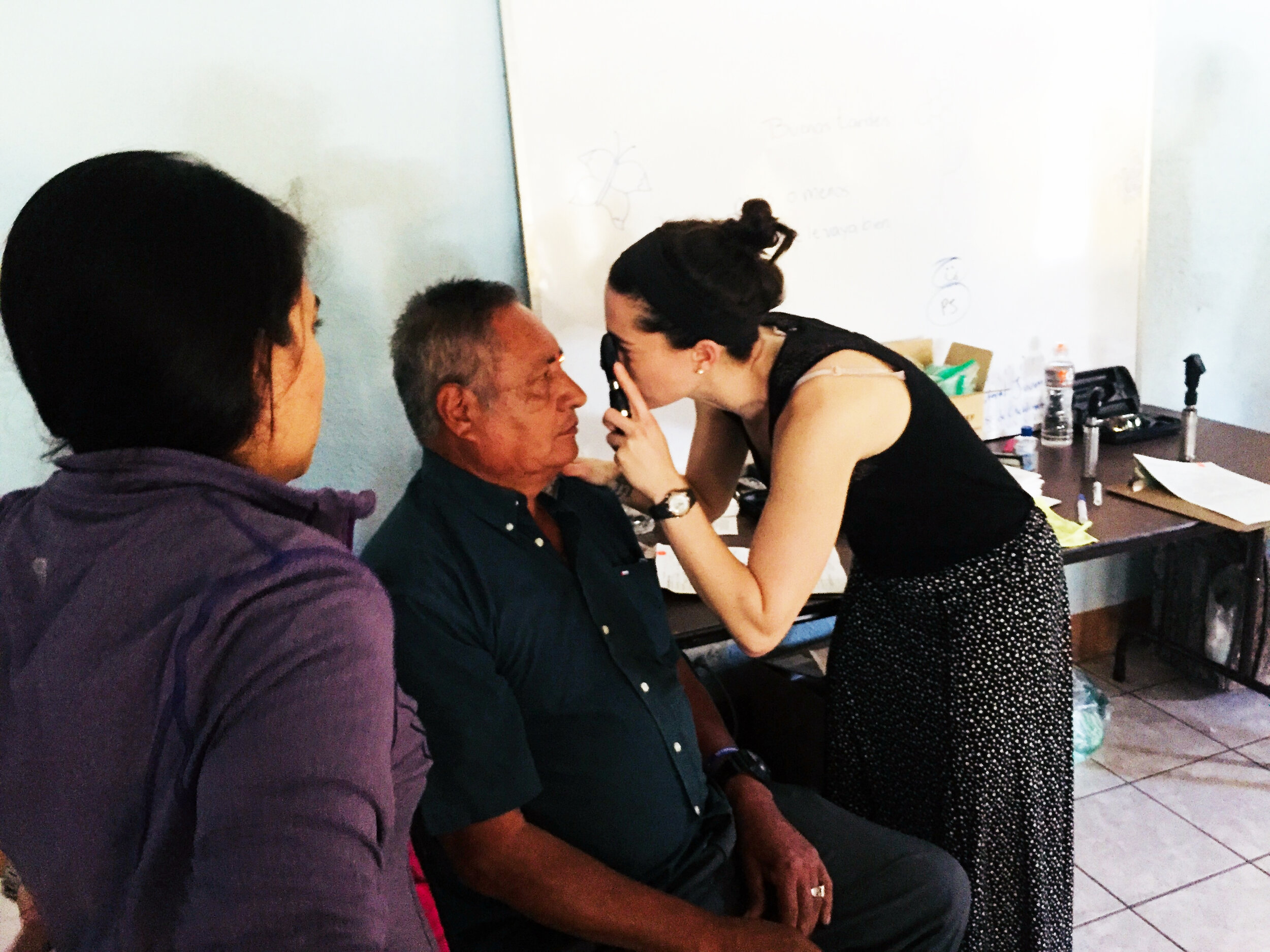 Dr. Jen McNamara examining a patient.