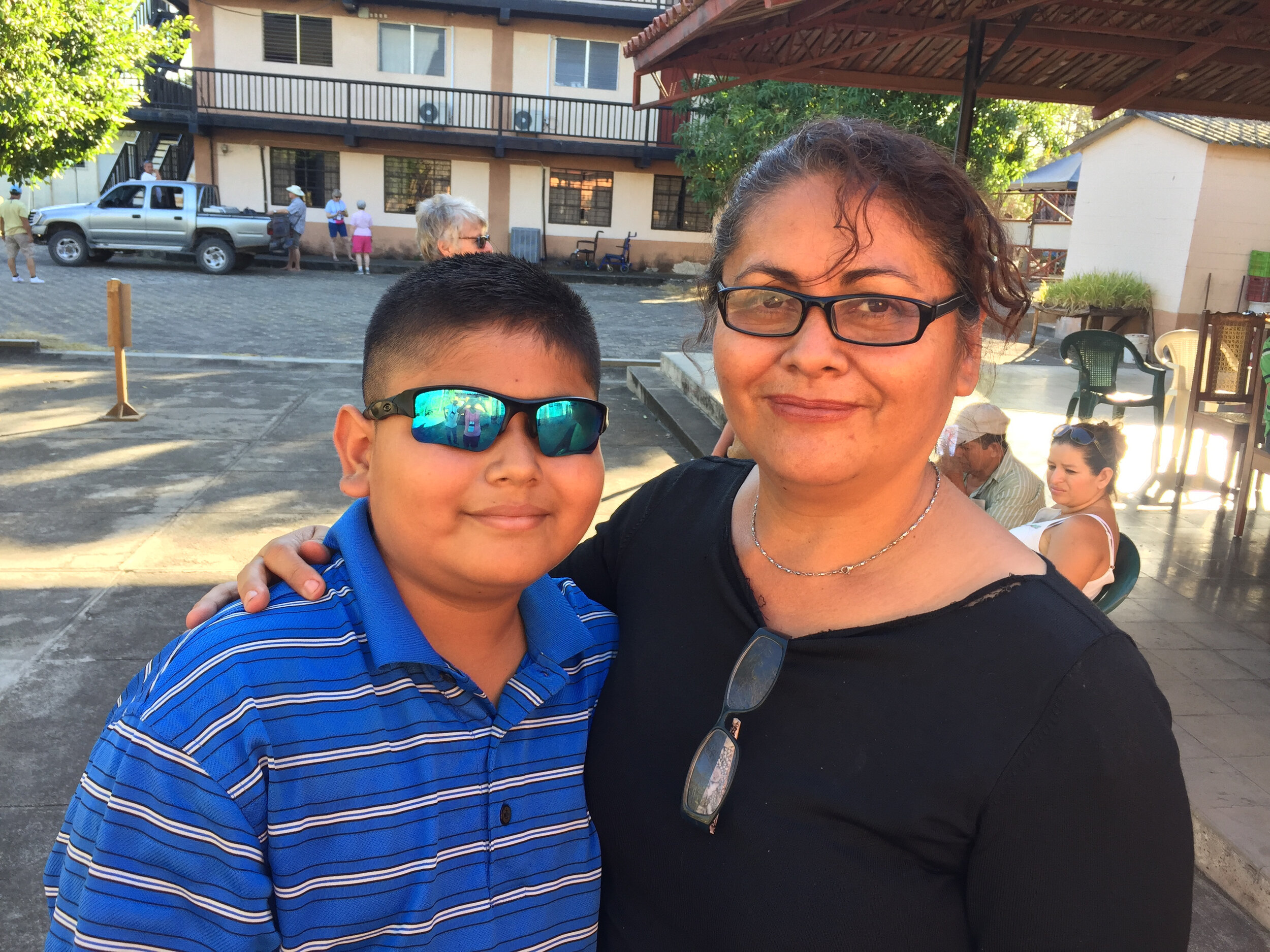 El Salvadoran mother and son showing off their new eyeglasses.
