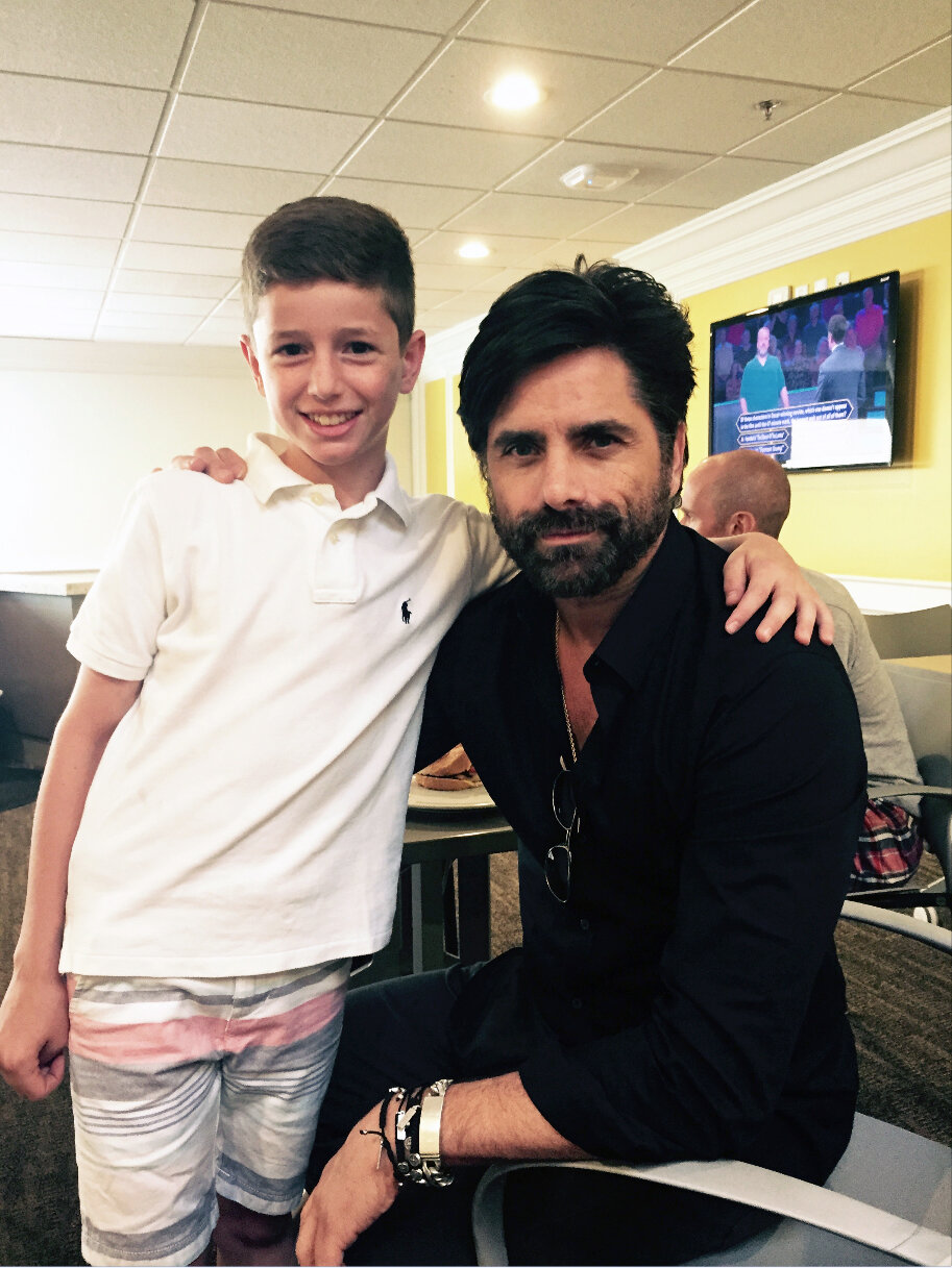 …. where her brother Patrick also posed with Stamos. 