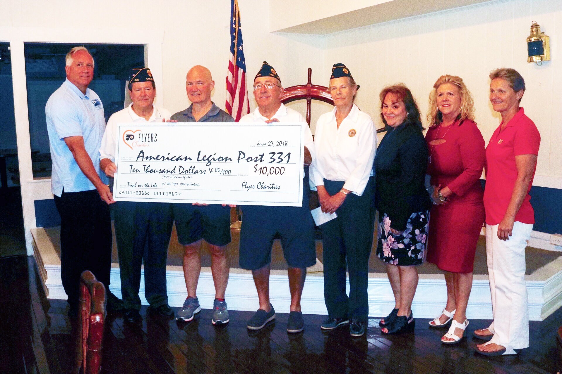  Posing with check from Flyers Charities (from left): Mike Couch (Coast Guard Community Foundation), Jon Ready (Post 331 trustee),   Jim McCrossin (Flyers trainer), Tom McCullough (Post 331 commander), Martha Schulz (Post 331 adjutant), Lisa Williams