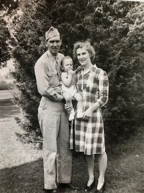 Jeff Pierson is held by his parents, Frank and Gladys, after Frank returned from serving in World War II.