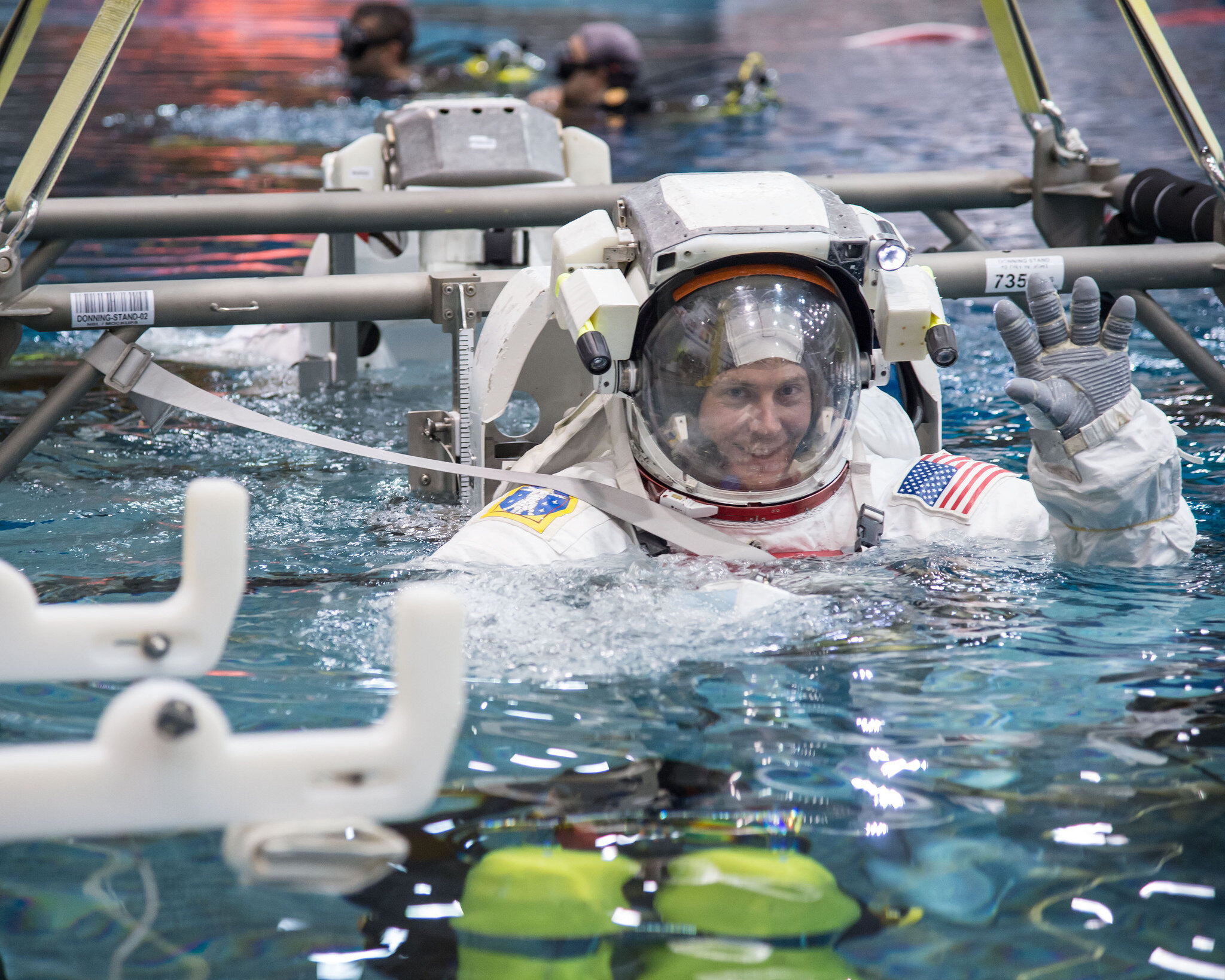 As part of his spacewalk training, Hague is submerged in water.