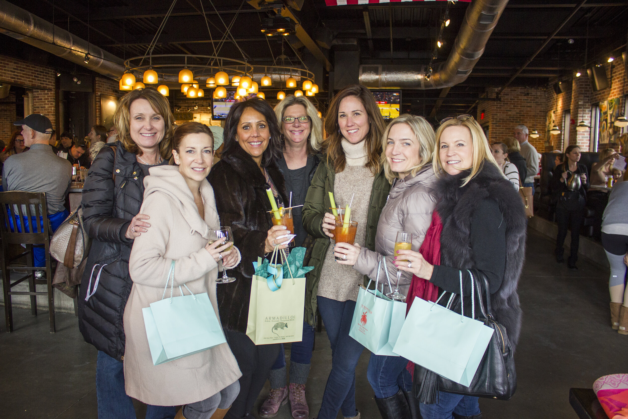 Eileen Delfini, Amanda Leone, Sue Sottung, Candace Brooks, Jennifer Essick,  Colleen Albrecht, and Alli Curro at Avalon’s Shop-A-Holics in March.
