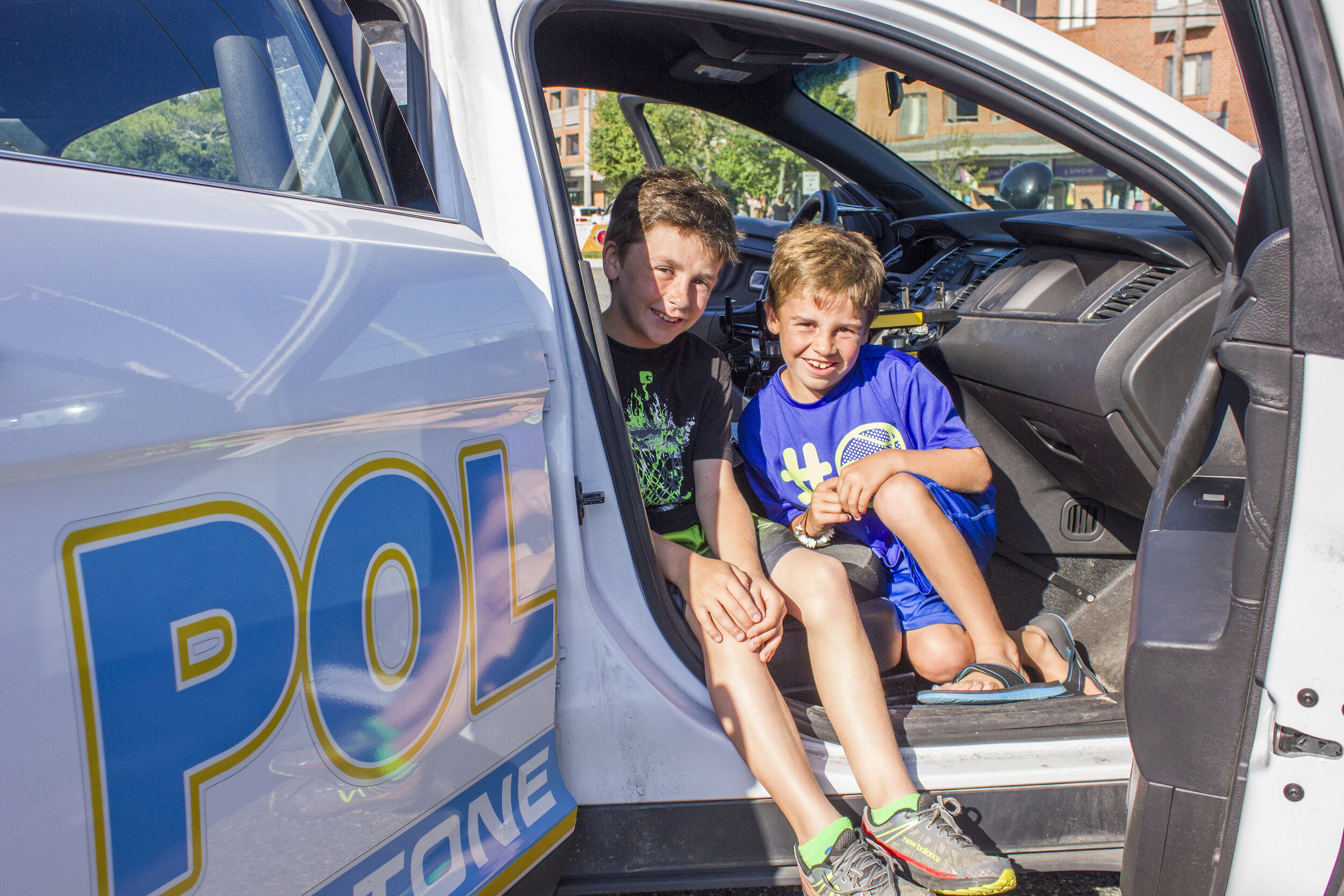 Will and Sam Tremel in a police car at Stone Harbor’s National Night Out.