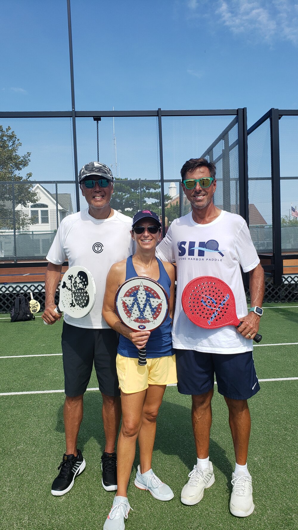 Stone Harbor paddle players (from left): Tom King, Laura Owens, and Greg Eger.
