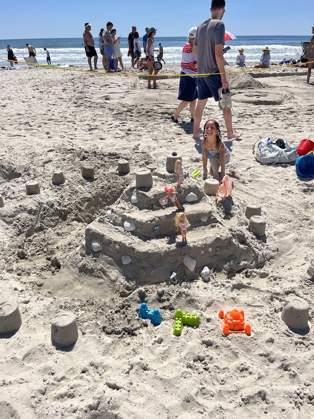 Lily Cipriano displays her castle masterpiece at the  Stone Harbor sand sculpting contest on July 4.