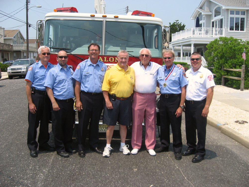 Jim Tipping (center), Borough Council president, joined fellow Avalon firefighters posing with retired Navy Capt. James O'Brien (third from right) at the town’s Flag Day celebration in 2008.