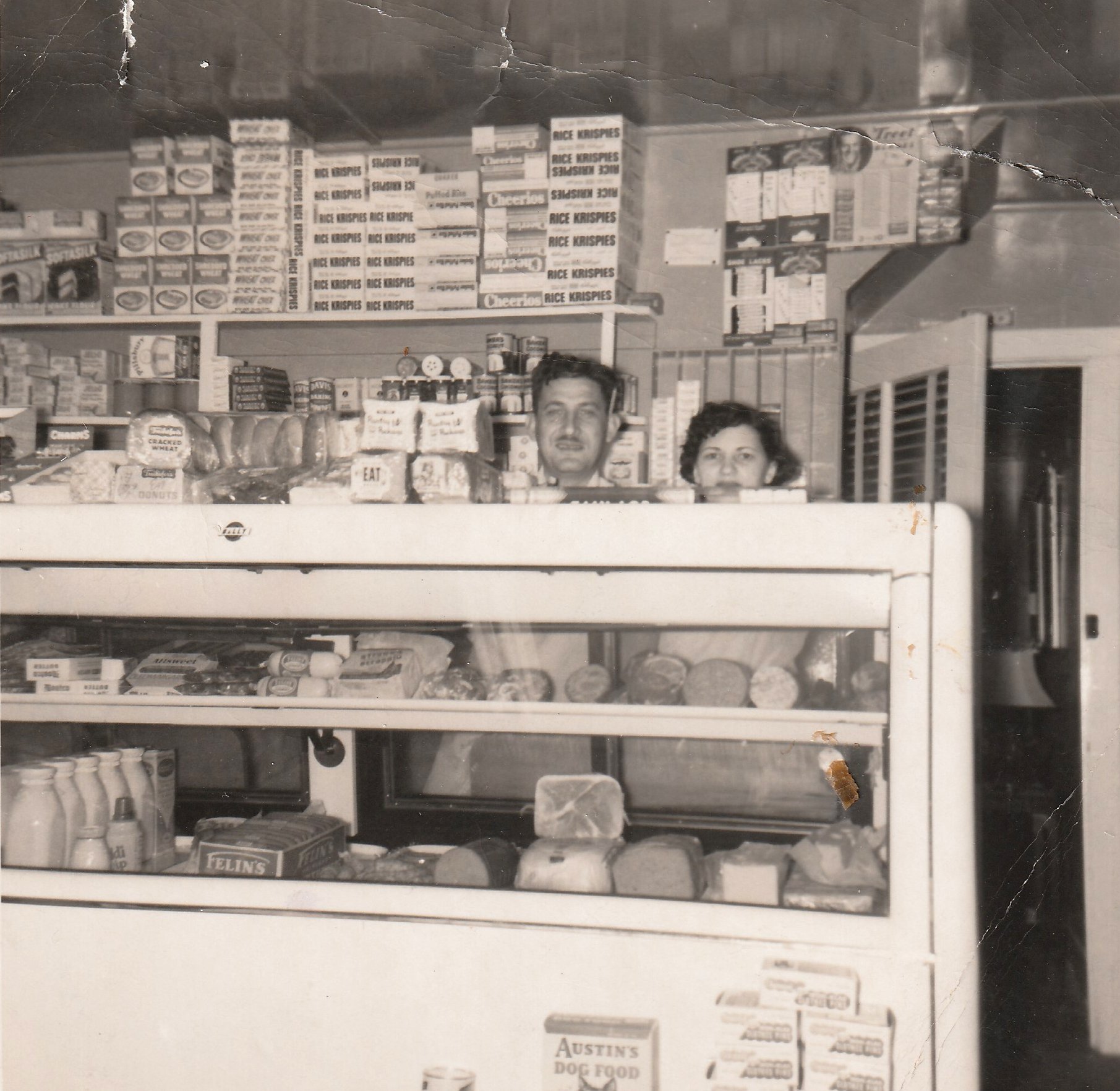 Sam and Jennie behind the deli counter in 1955.