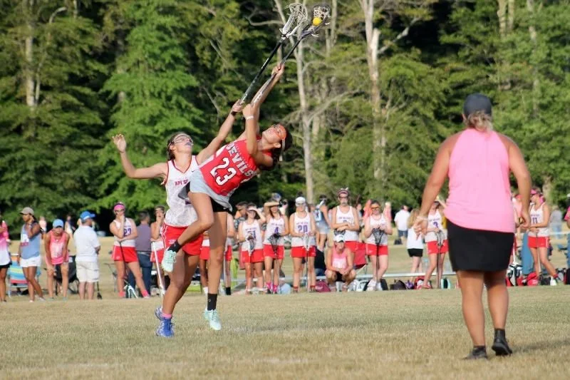 Bridget Ruskey, playing for the South Jersey Devils, cradles the ball away from an opponent.