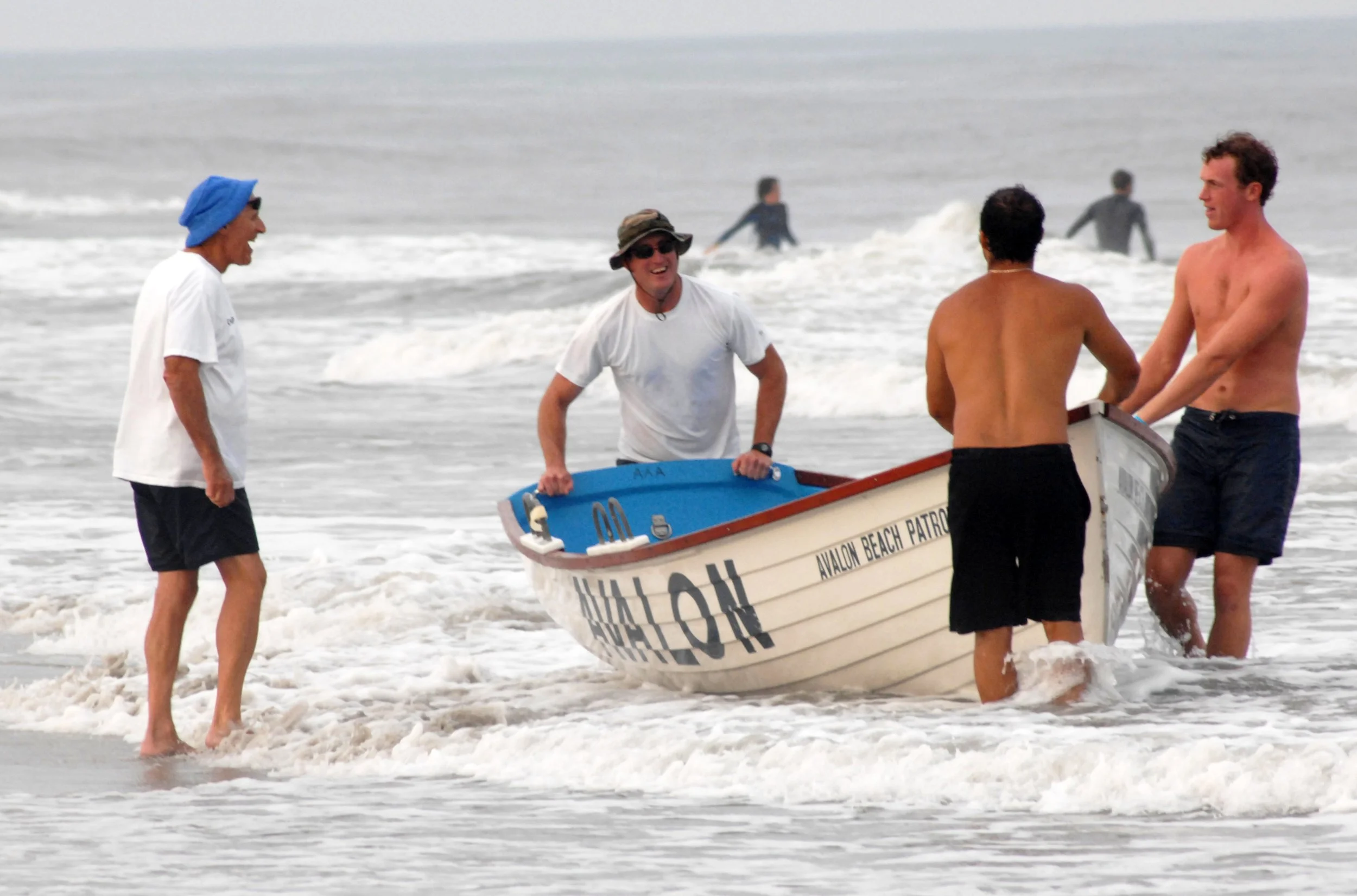 Wolf interacts with members of the patrol at a lifeguard competition.