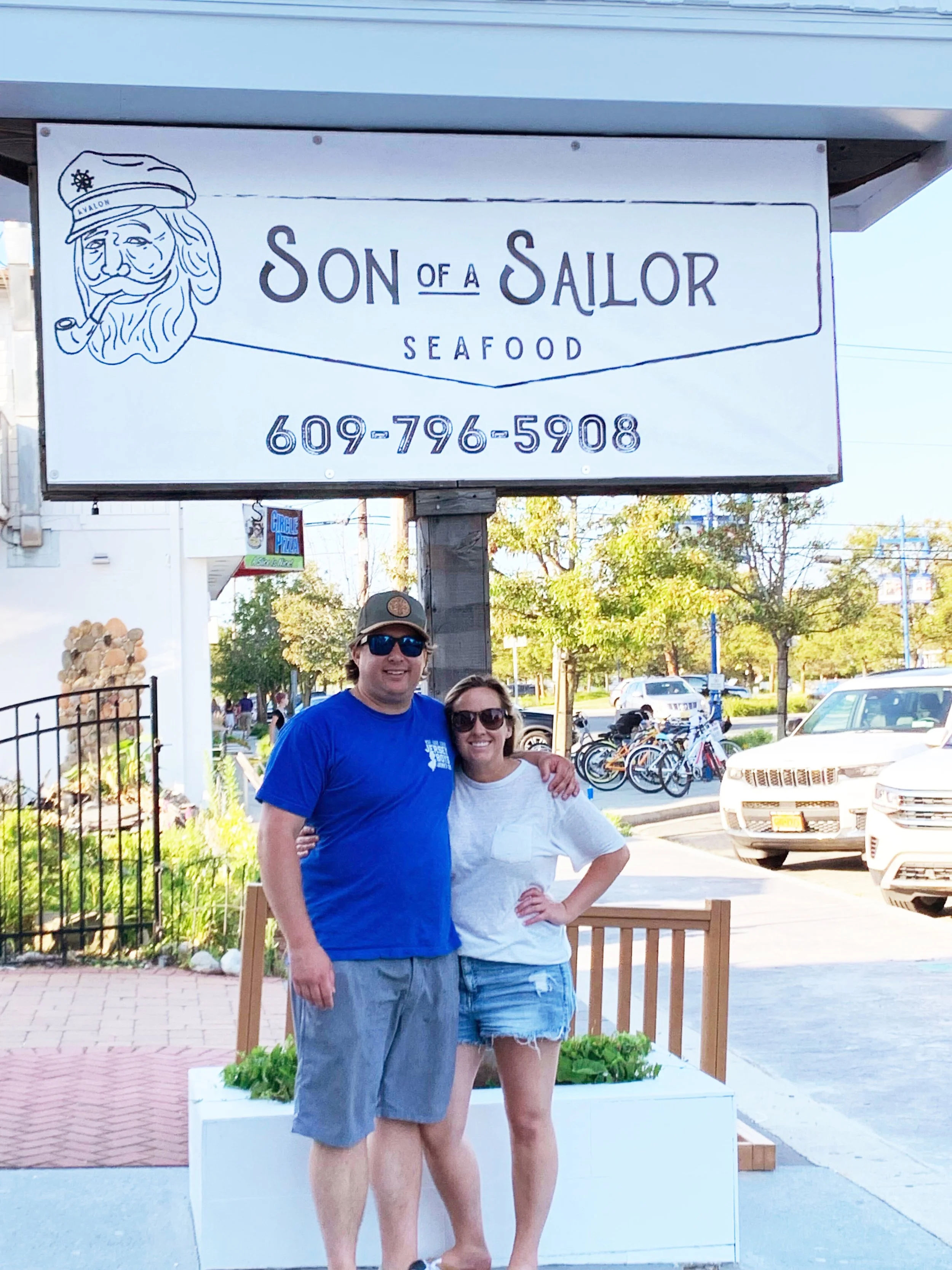 Paul and Kelly pose with their new sign the day before opening in 2022