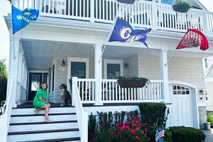 Run It Up the Flagpole: 7 Mile Homeowners Proudly Represent Their Alma Maters