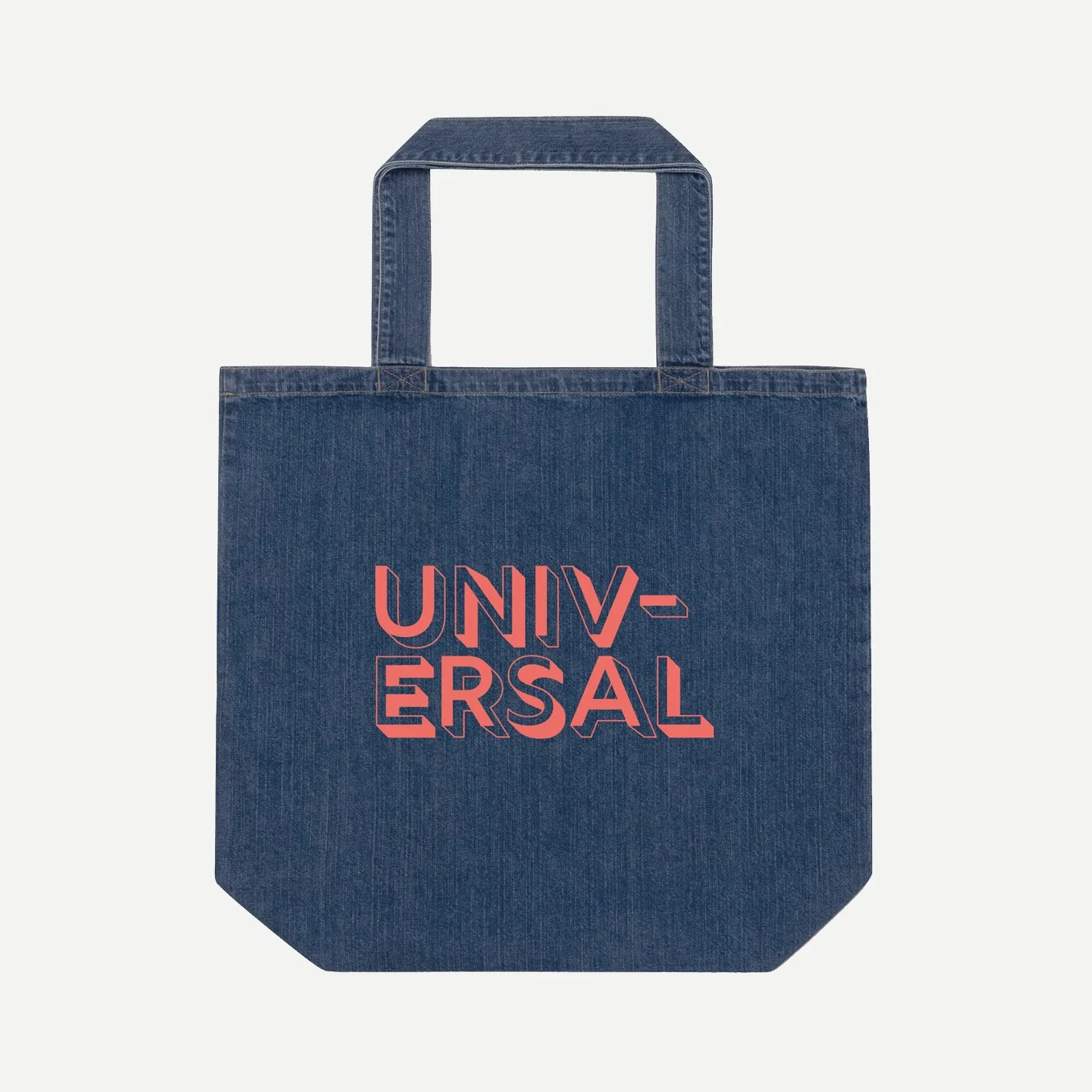 Large denim tote bag on a gray background with the word, Universal printed across the front in a warm red, outlined font.