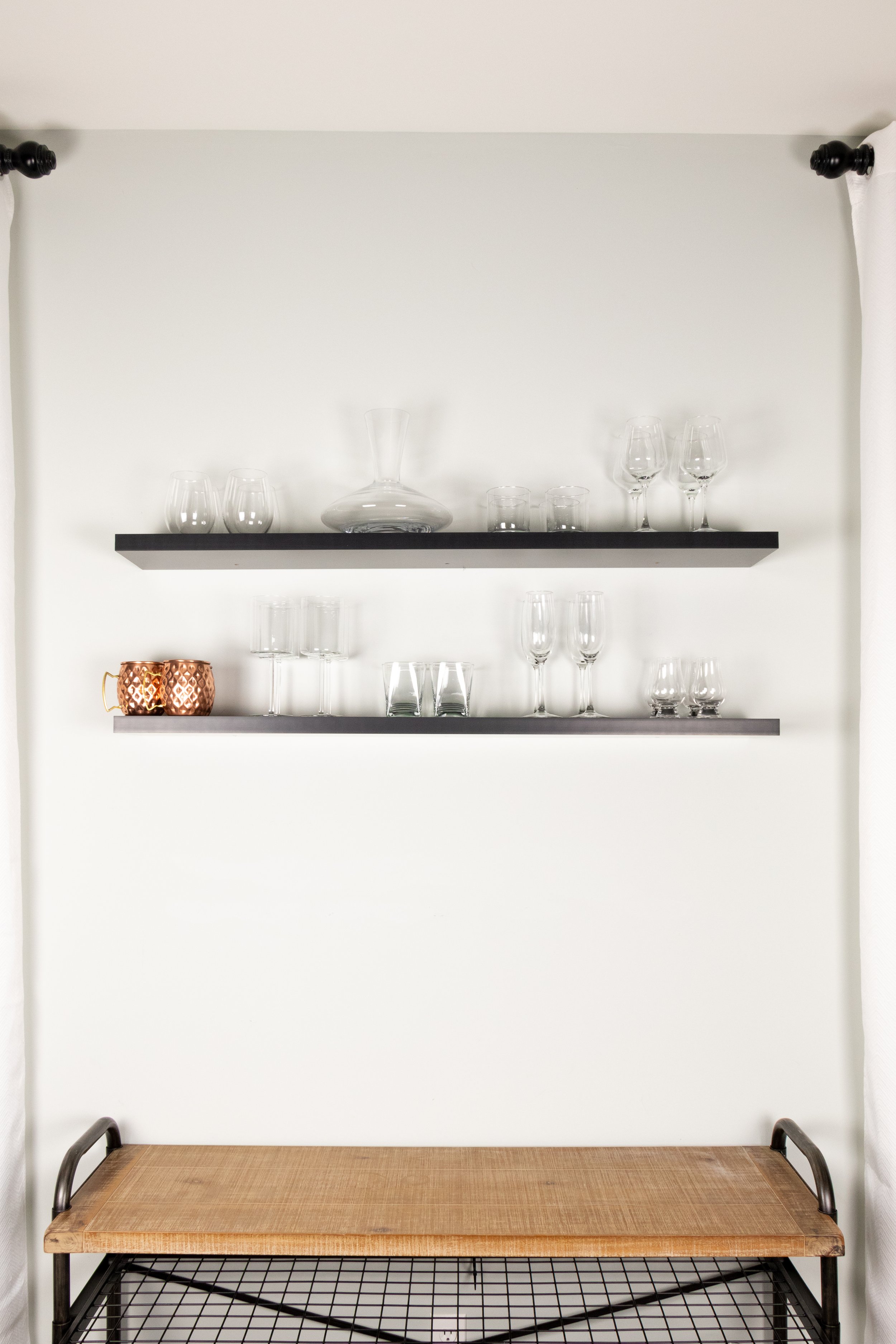 organize glassware on floating open shelves for your home bar