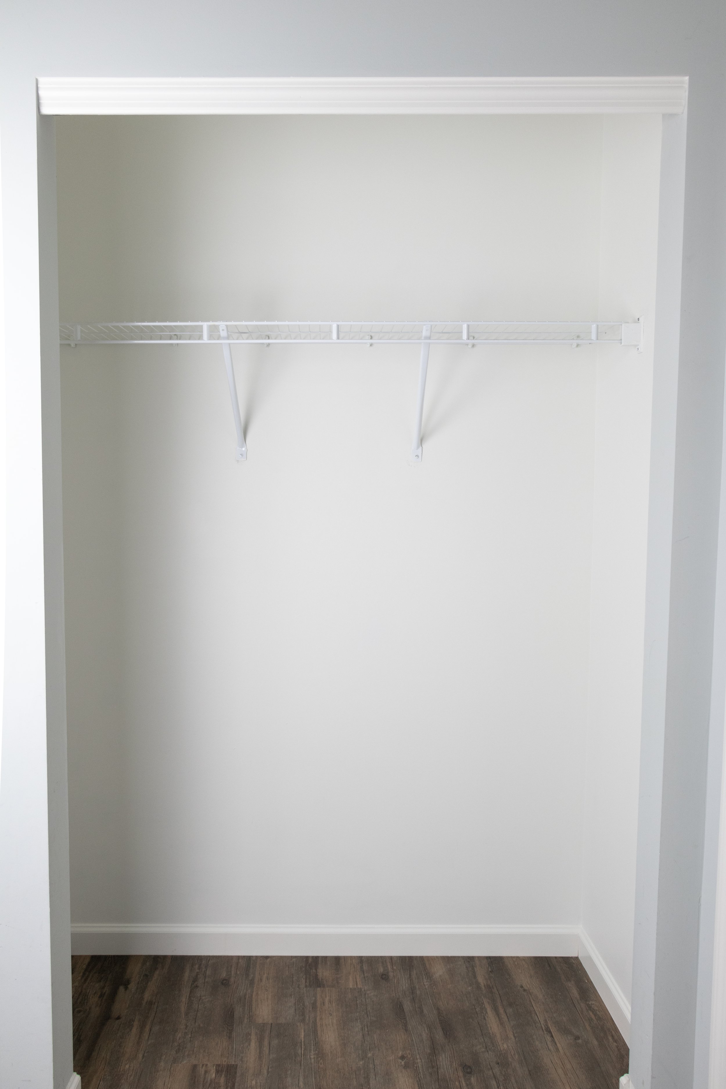how to makeover a coat closet into a storage closet using a wire shelf