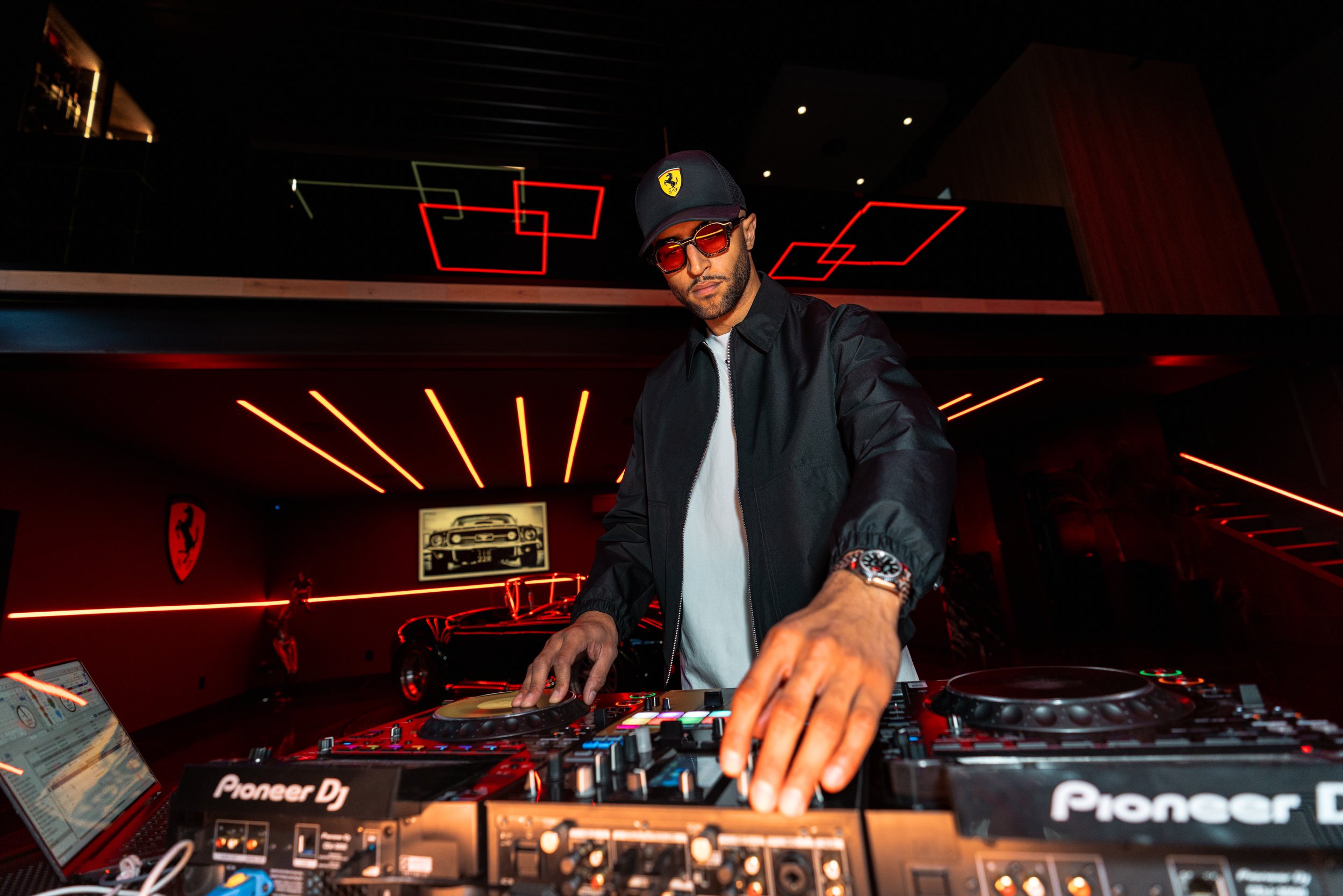 orlando dj iman tucker performs inside of a private garage