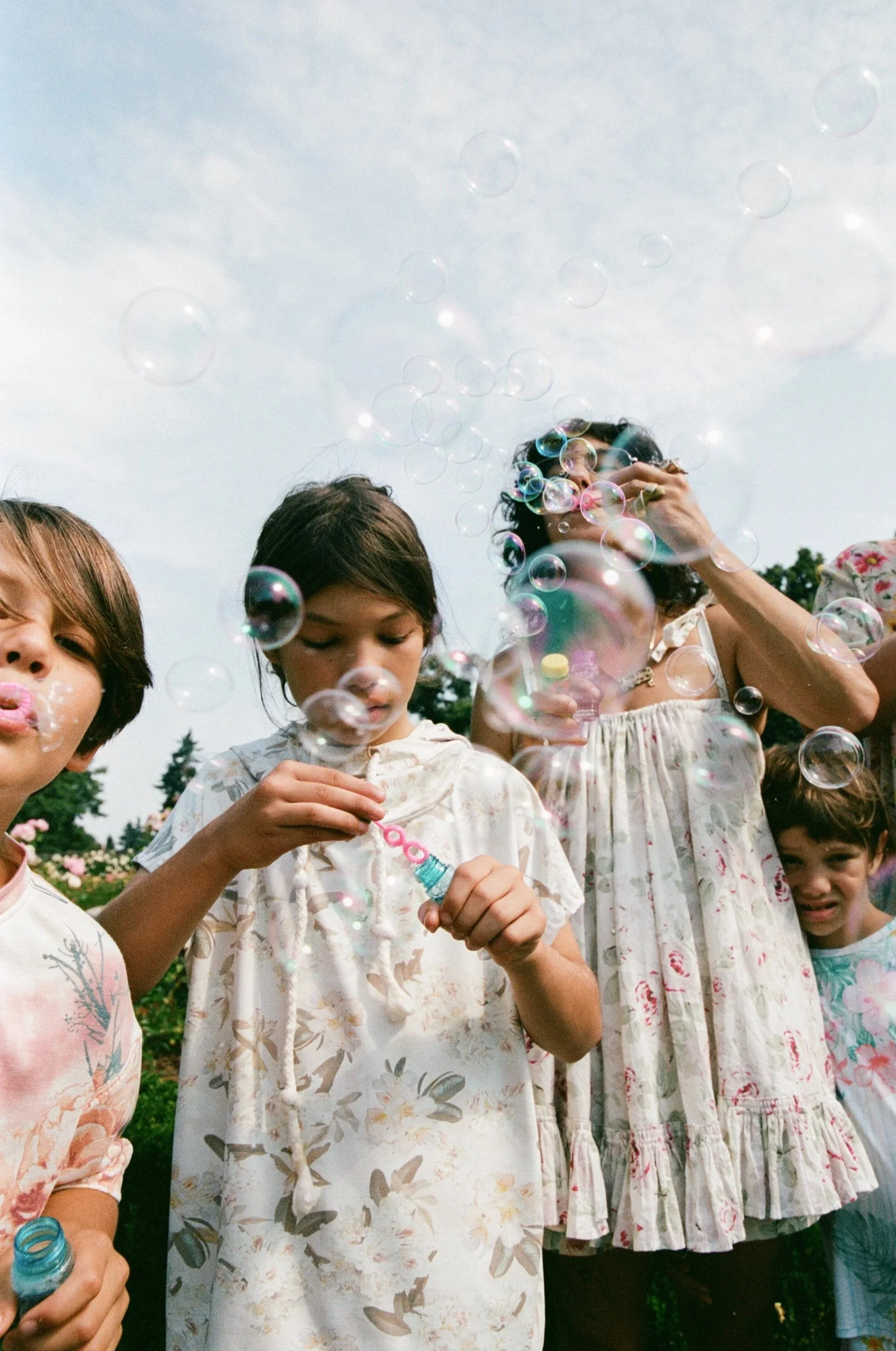 A photo from a Portland, Oregon family session in Peninsula Park, captured on 35mm film.