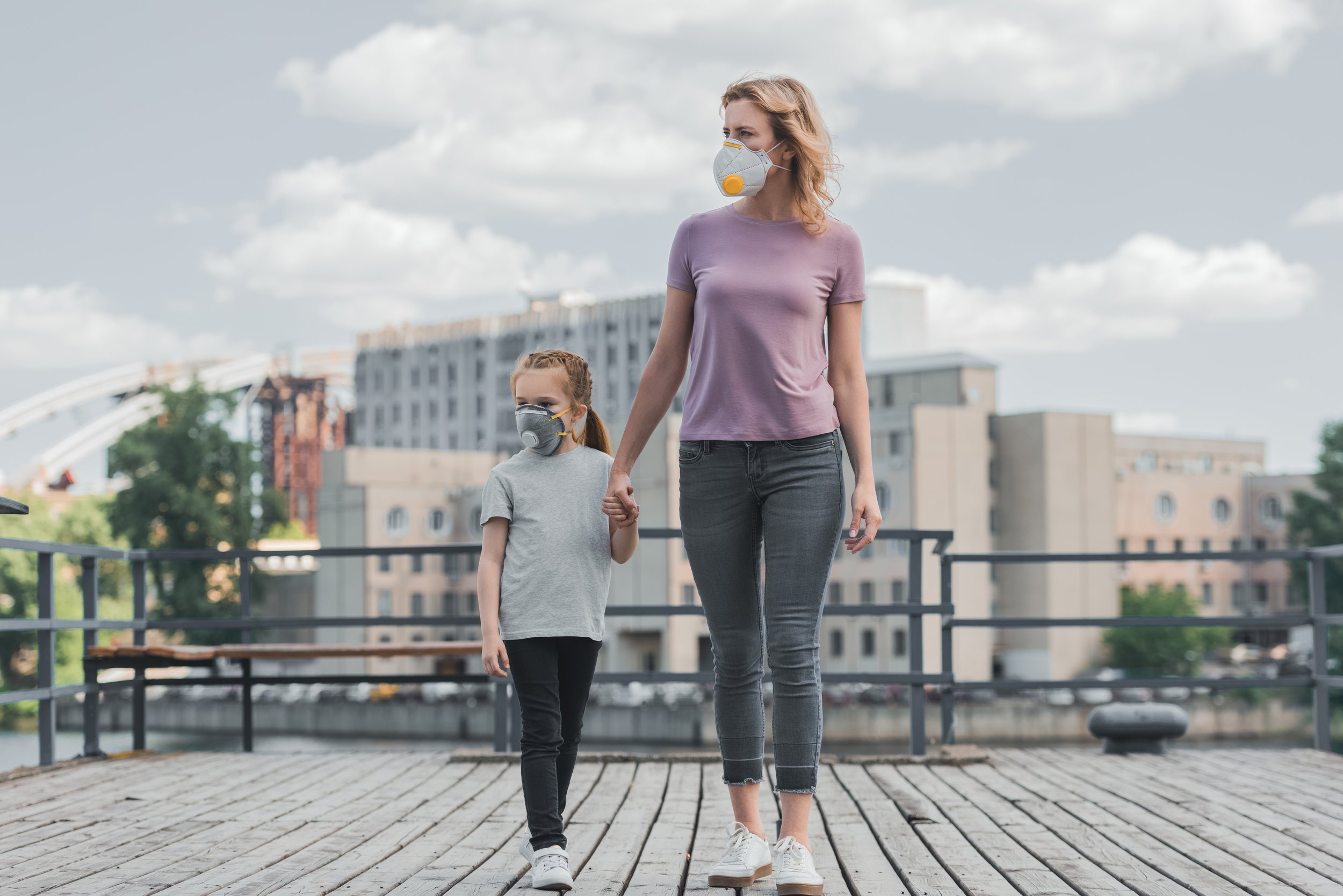 VistaCreate-196900618-stock-photo-mother-daughter-protective-masks-holding.jpeg