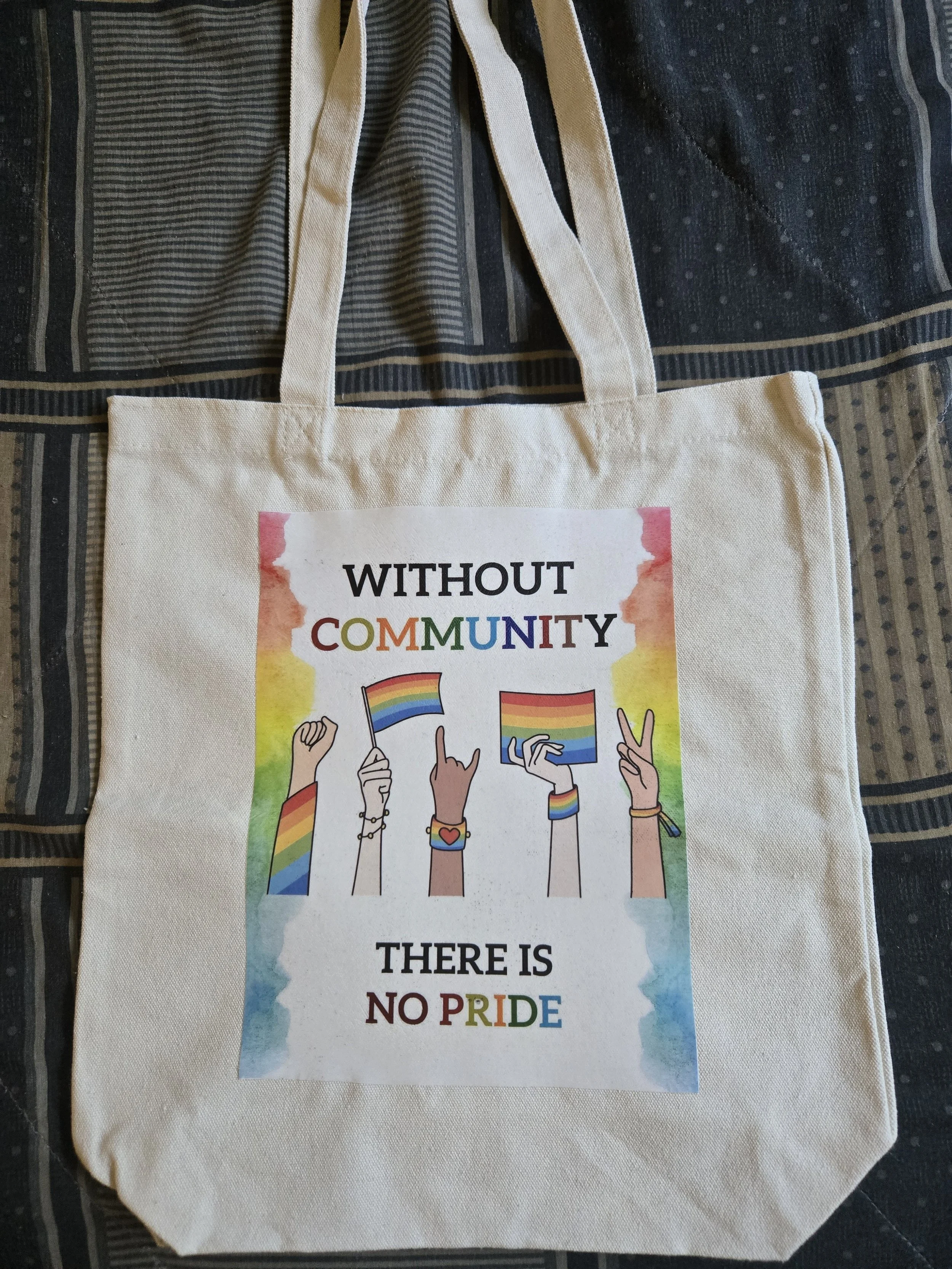 WITHOUT COMMUNITY THERE IS NO PRIDE Tote Bag