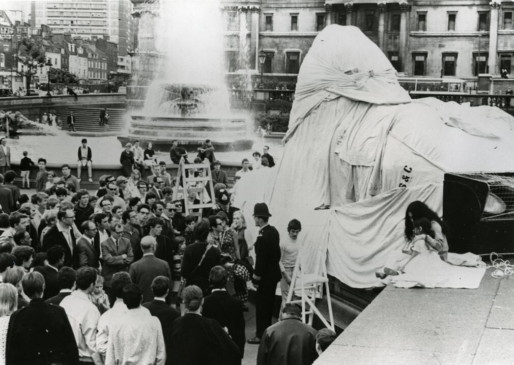  Bill (on the right, between the policeman and the step ladder) working with Yoko Ono in Trafalgar Square, in the Summer of 1967. Yoko, with Bill’s help, was wrapping the lions at the base of Nelson’s column, in a highly publicized performance seen l