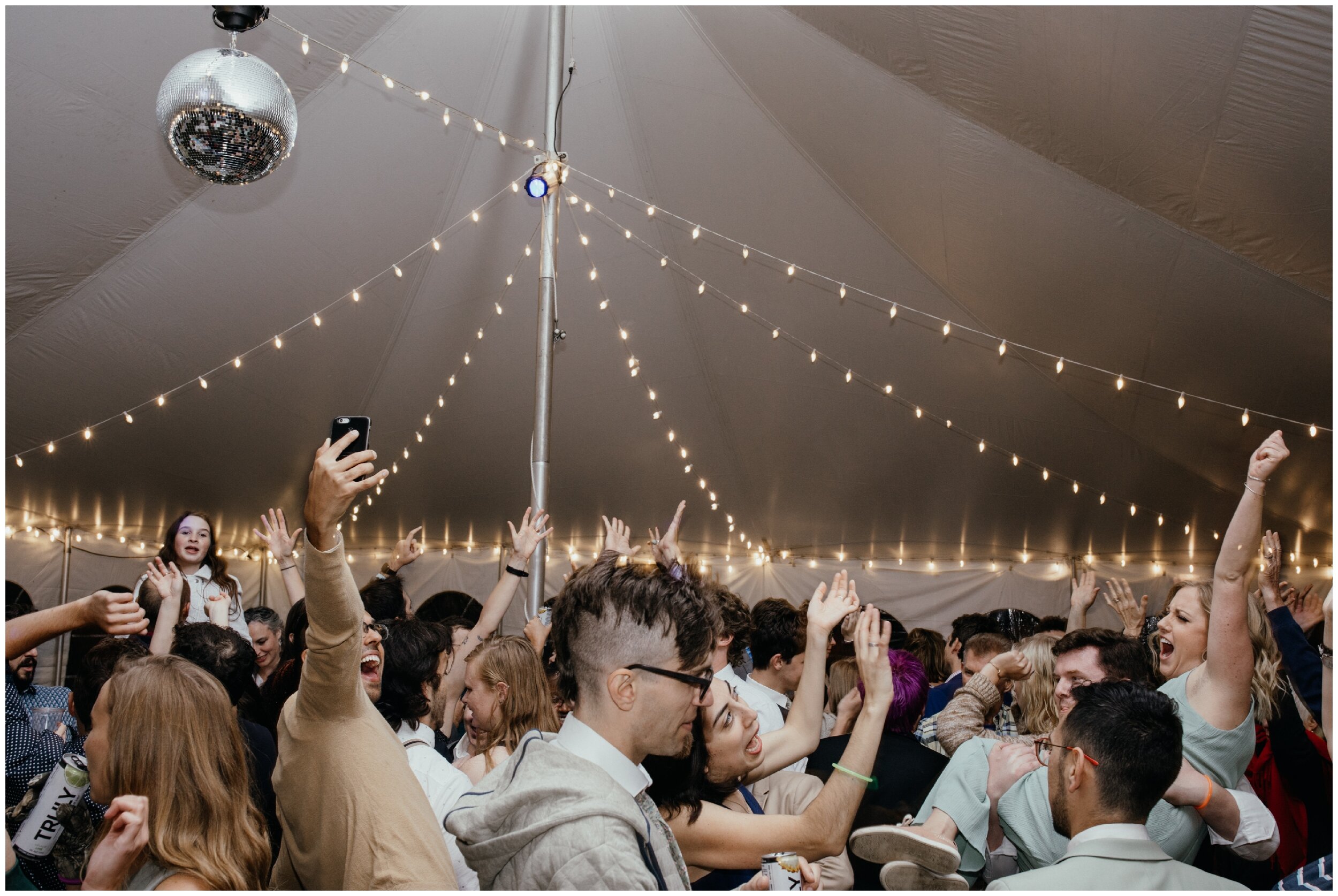 Disco ball tent wedding reception dance at Camp Warren in northern Minnesota