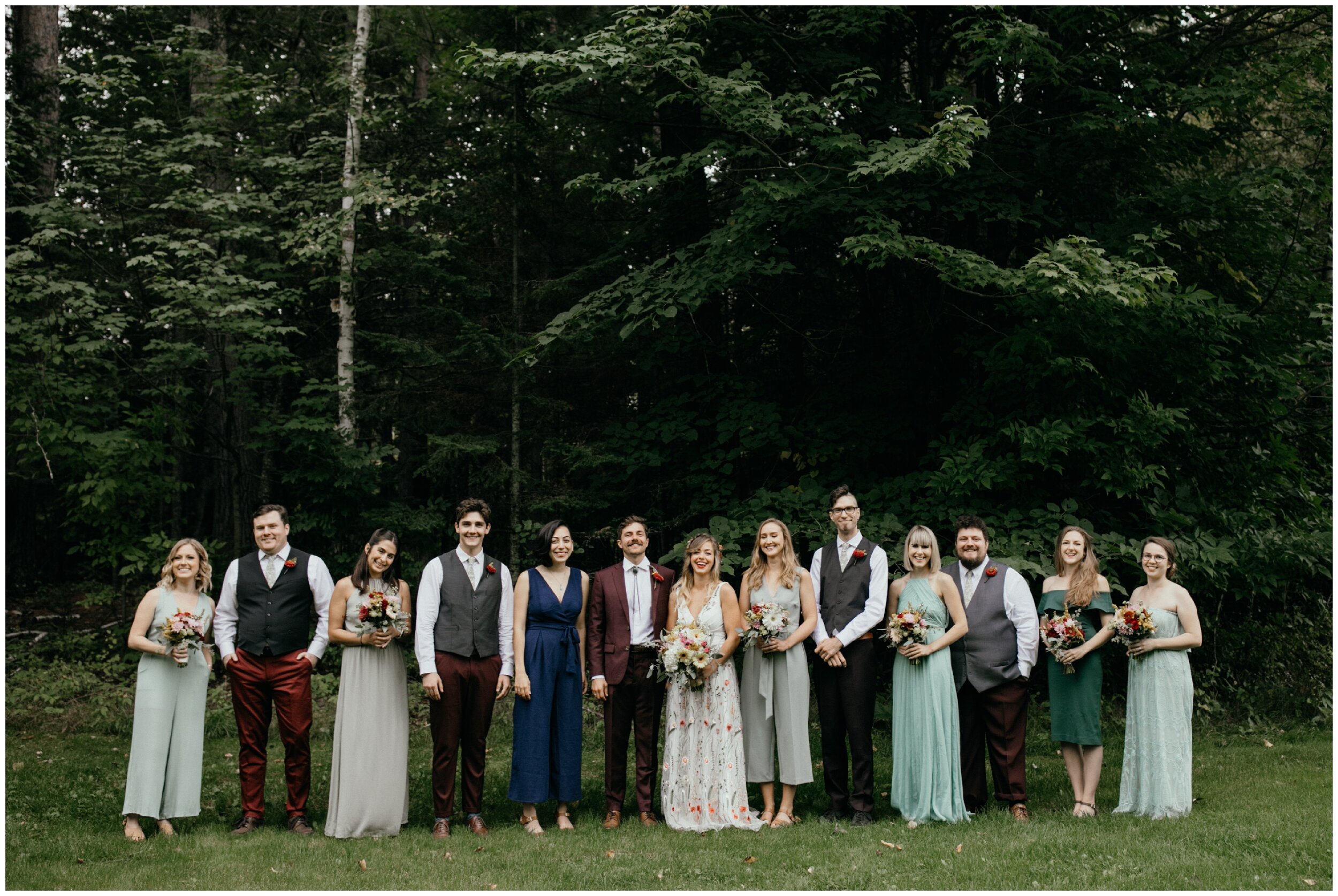 Bride and groom with wedding party at Camp Warren wedding in Eveleth Minnesota