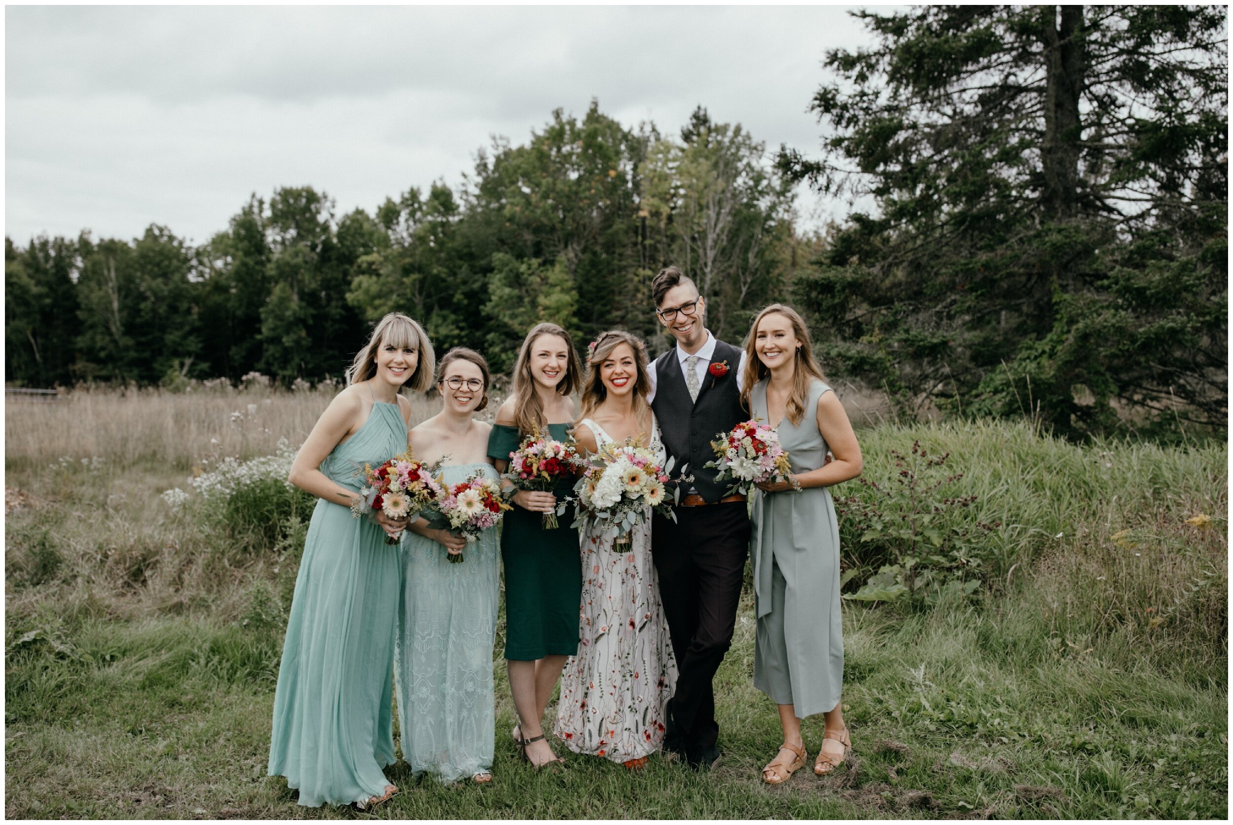 Bride and wedding party at summer camp wedding in northern Minnesota