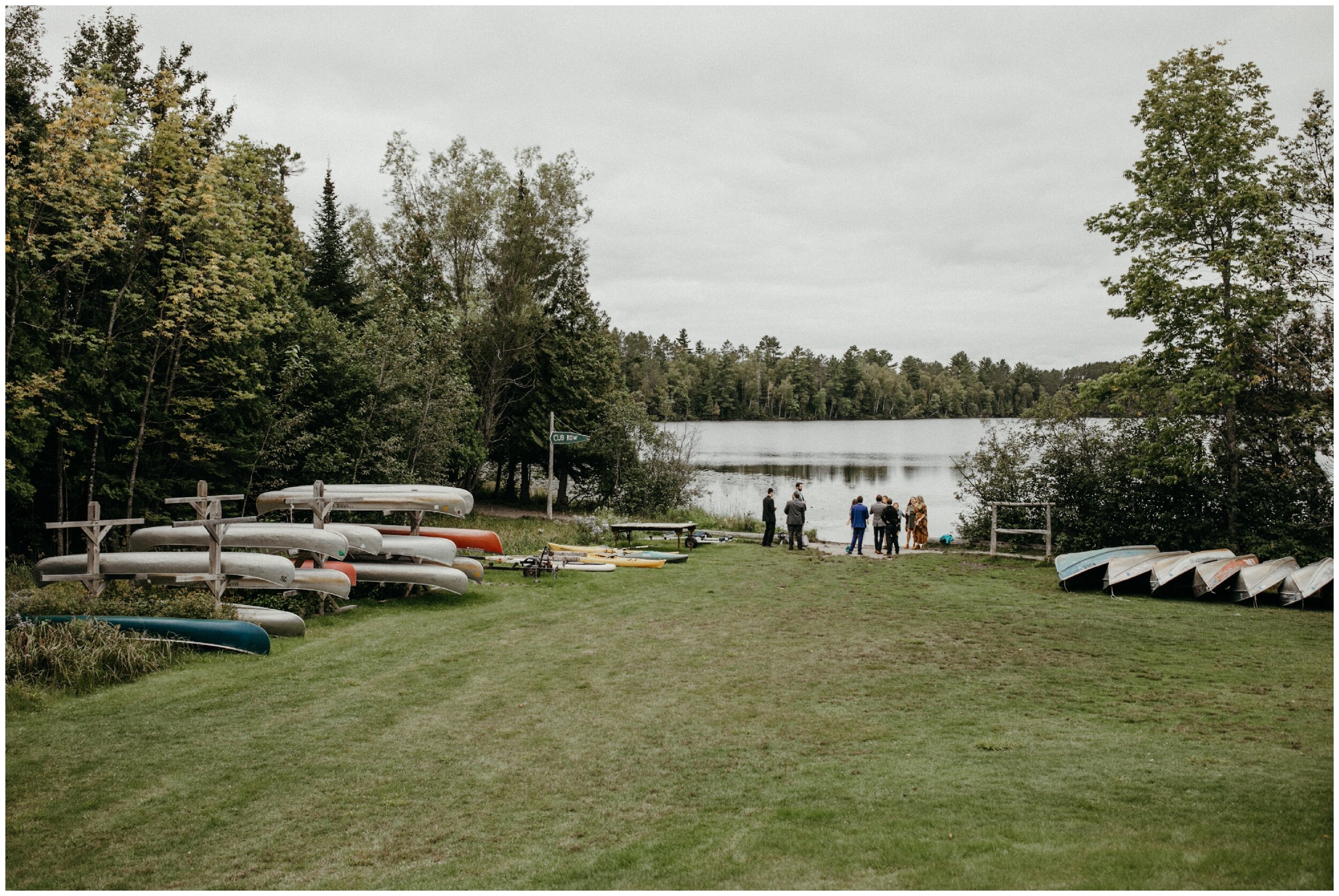 Guest arriving to northern Minnesota summer camp wedding on half moon lake in Eveleth Minnesota