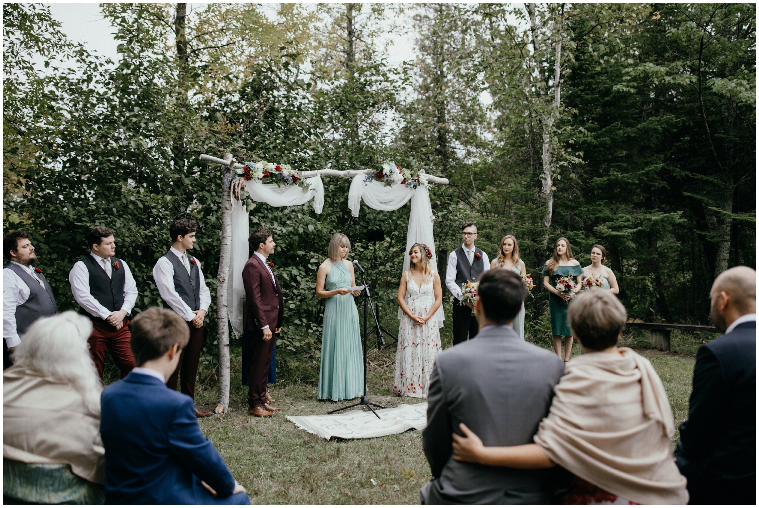 Boho inspired summer camp wedding on half moon lake in northern Minnesota
