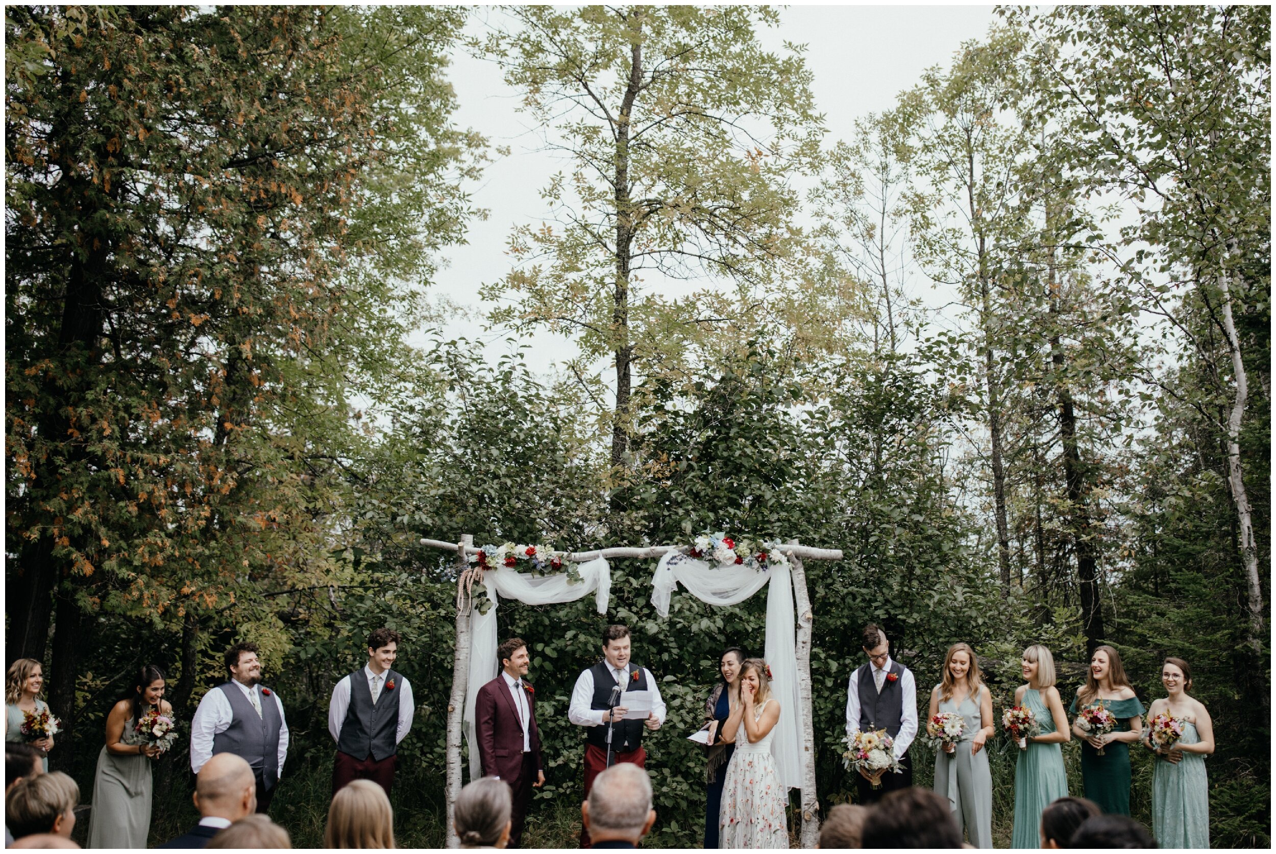 Outdoor wedding ceremony in the woods at Minnesota summer camp