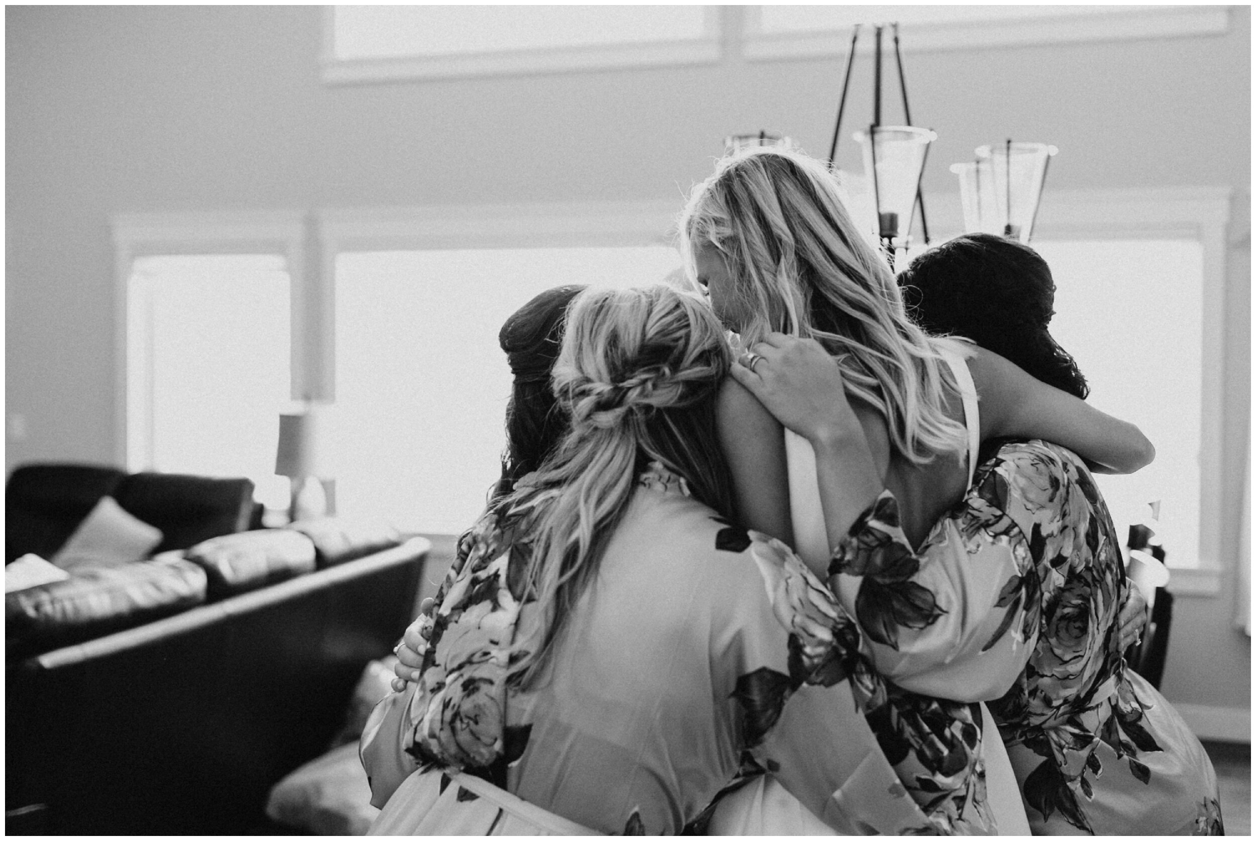 Bride hugging bridesmaids at Grand View Lodge wedding