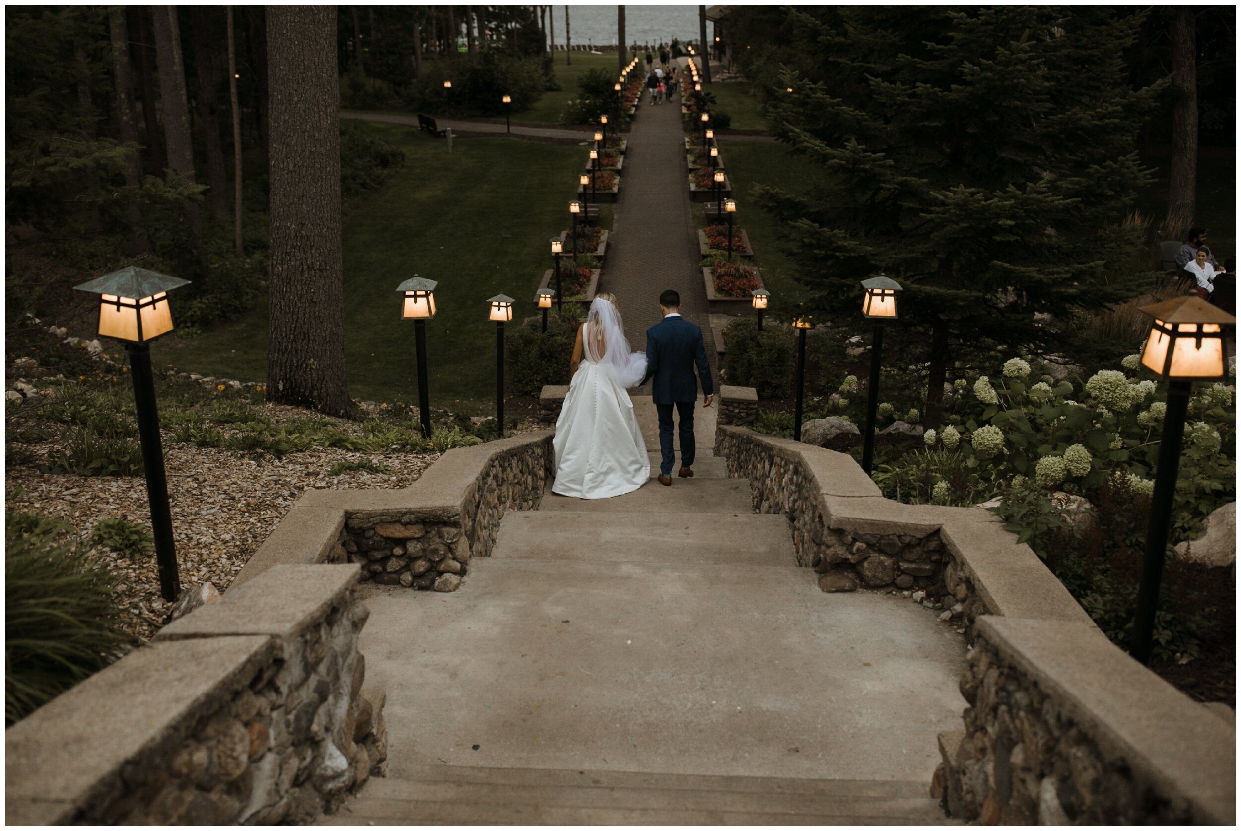 Bride and groom walking down stair case at Grand View Lodge wedding