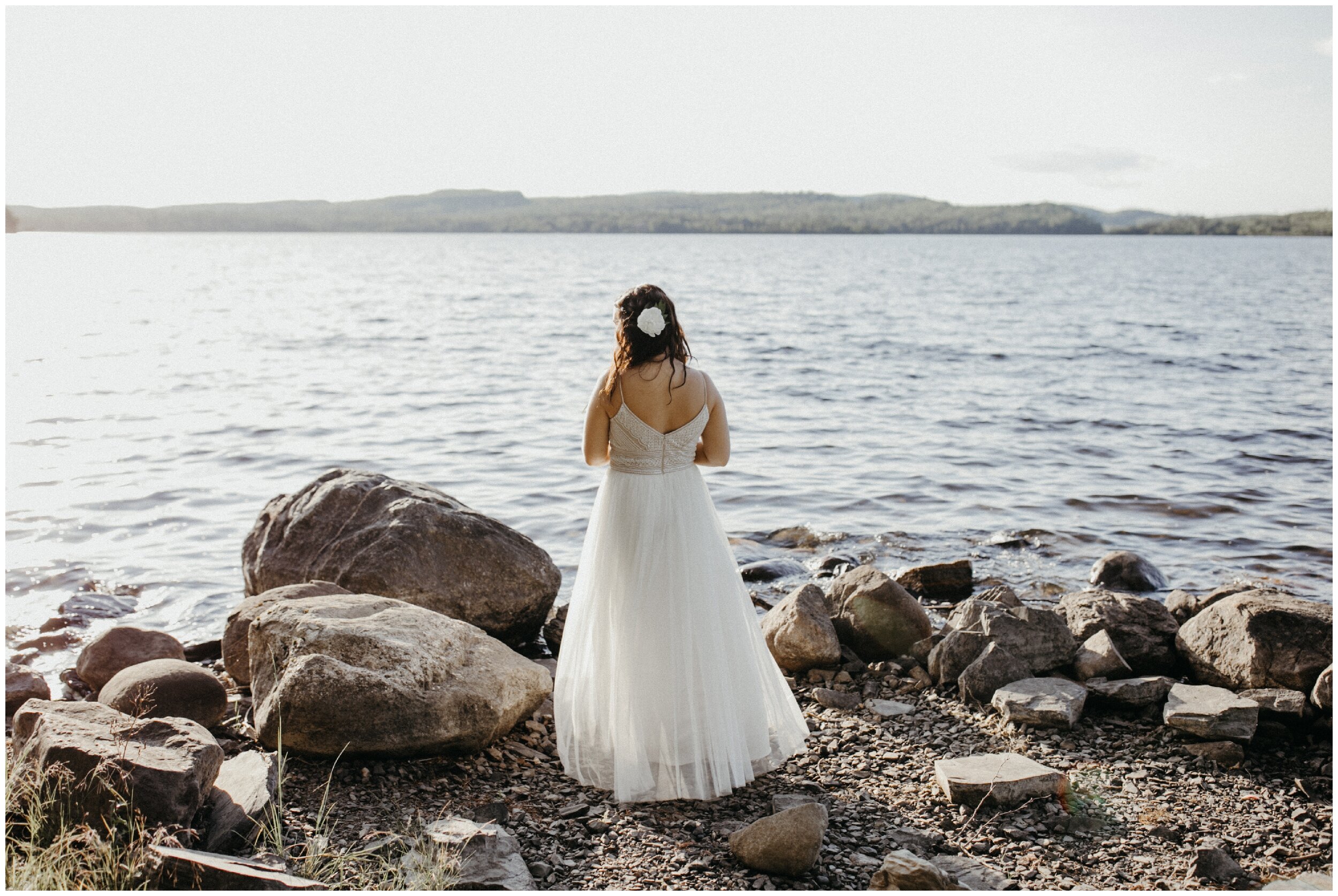Bride overlooking Gunflint lake on her wedding day