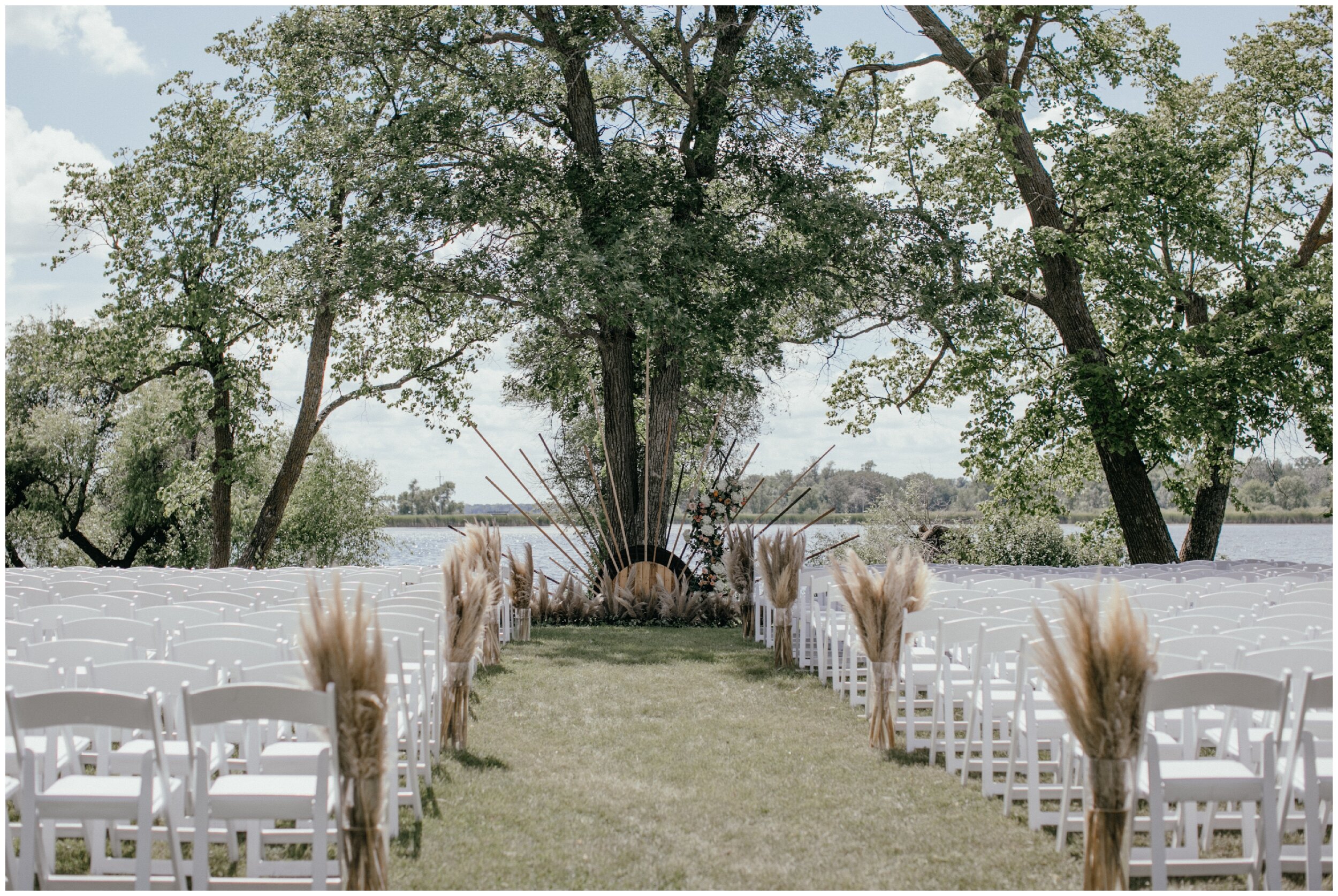 Minnesota backyard summer wedding ceremony with pampas grass decor