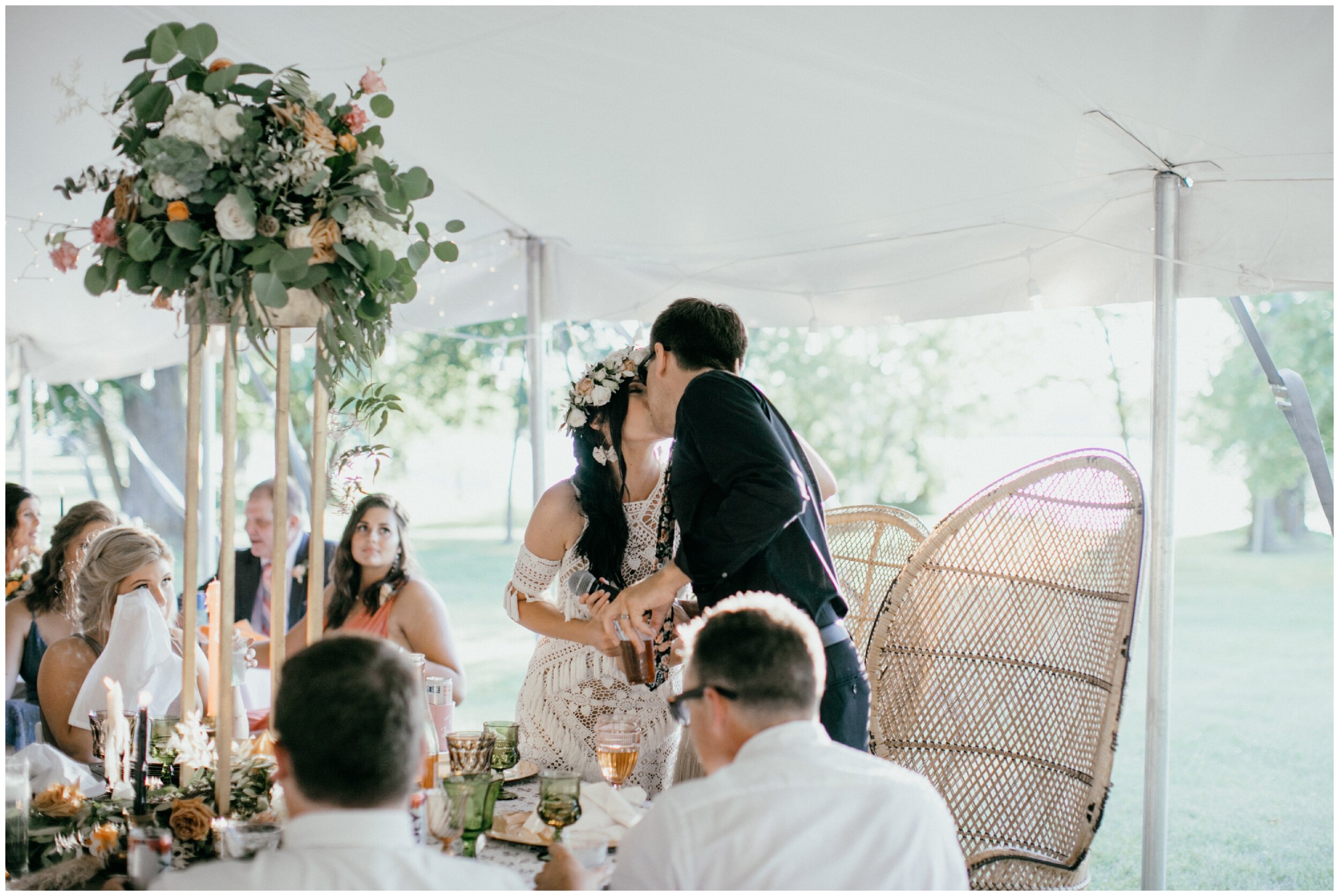 Bride and groom kissing at Minnesota backyard wedding reception
