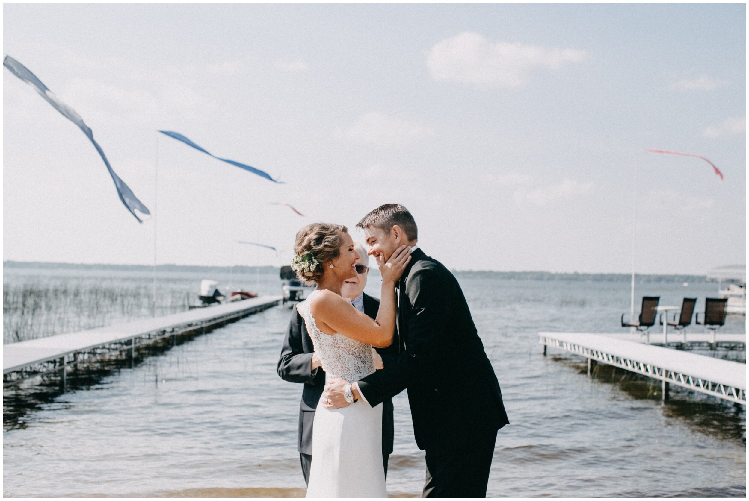 Bride and groom married on lakeside beach in Brainerd, Minnesota