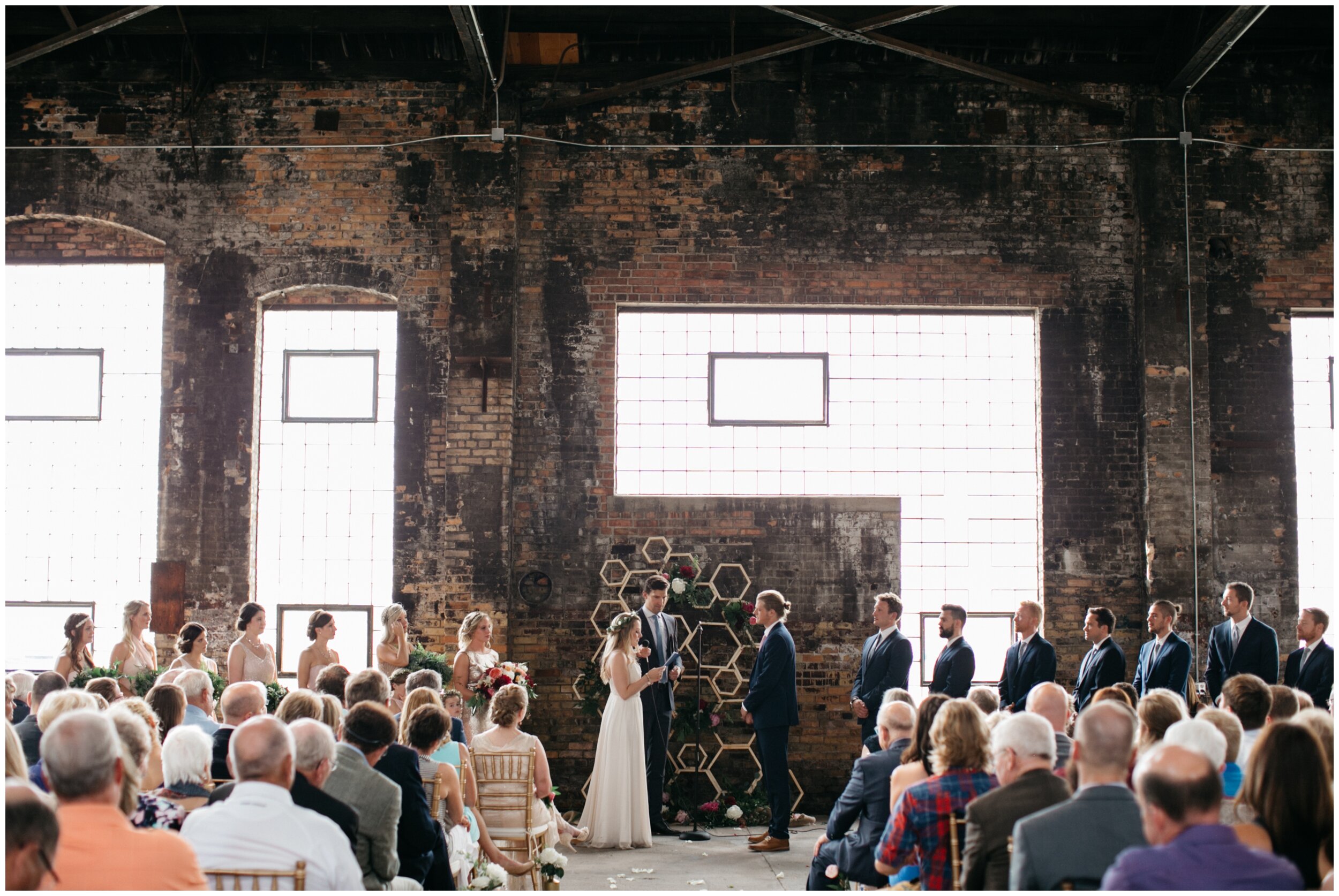 Industrial wedding ceremony inside warehouse at the Northern Pacific Center in Brainerd, Minnesota