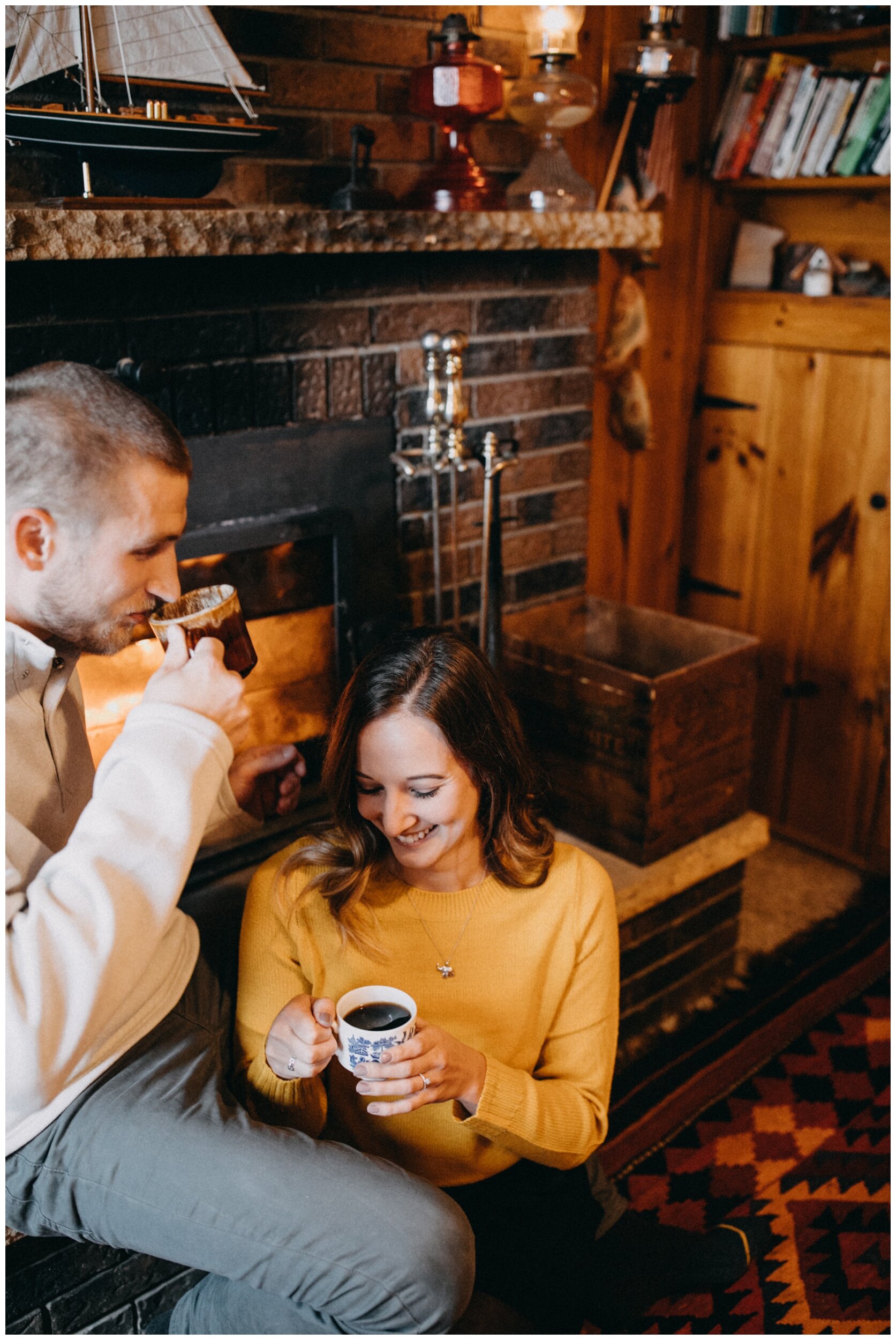 Fireside cabin engagement session with coffee