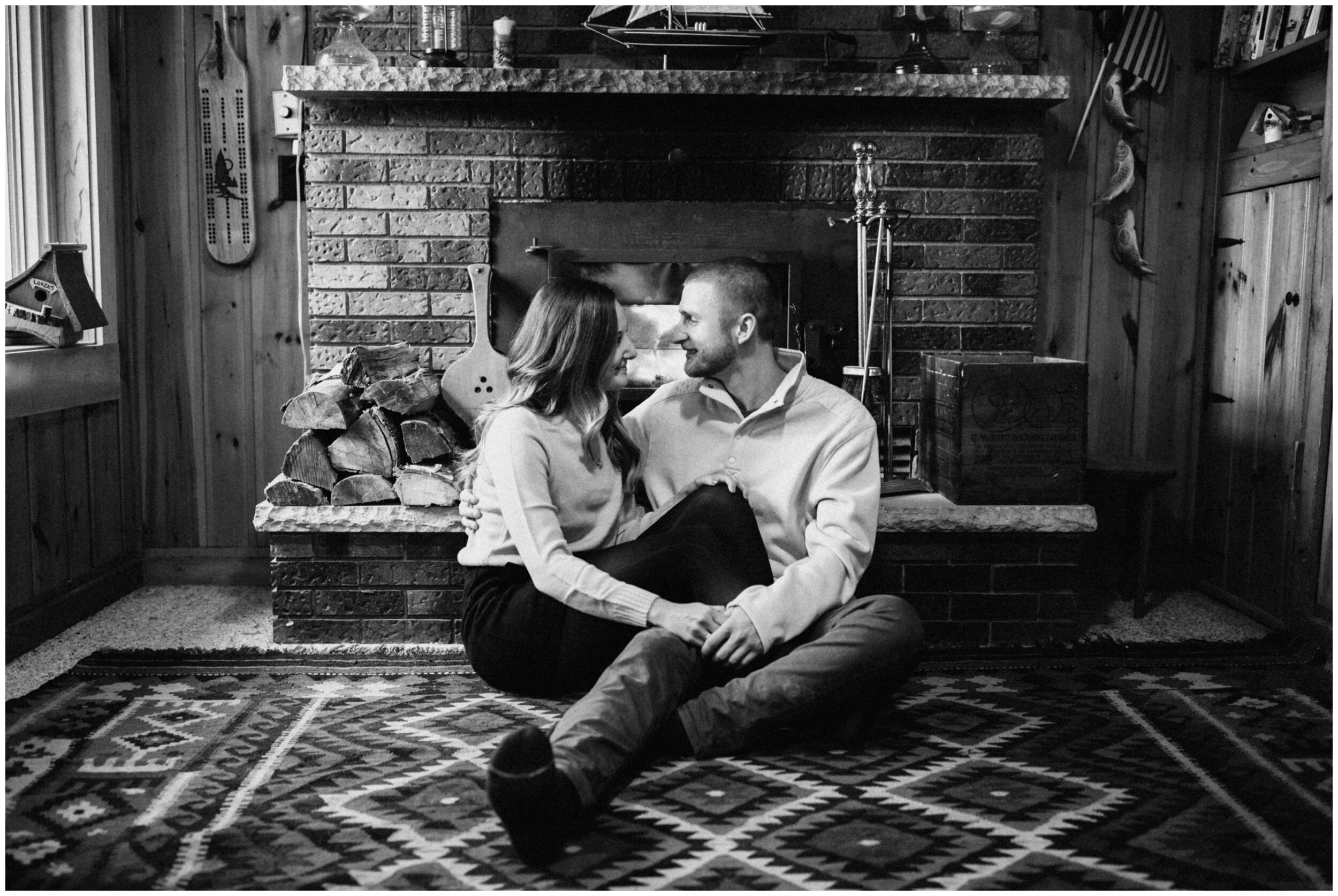 Intimate northern Minnesota cabin engagement session by the fireplace