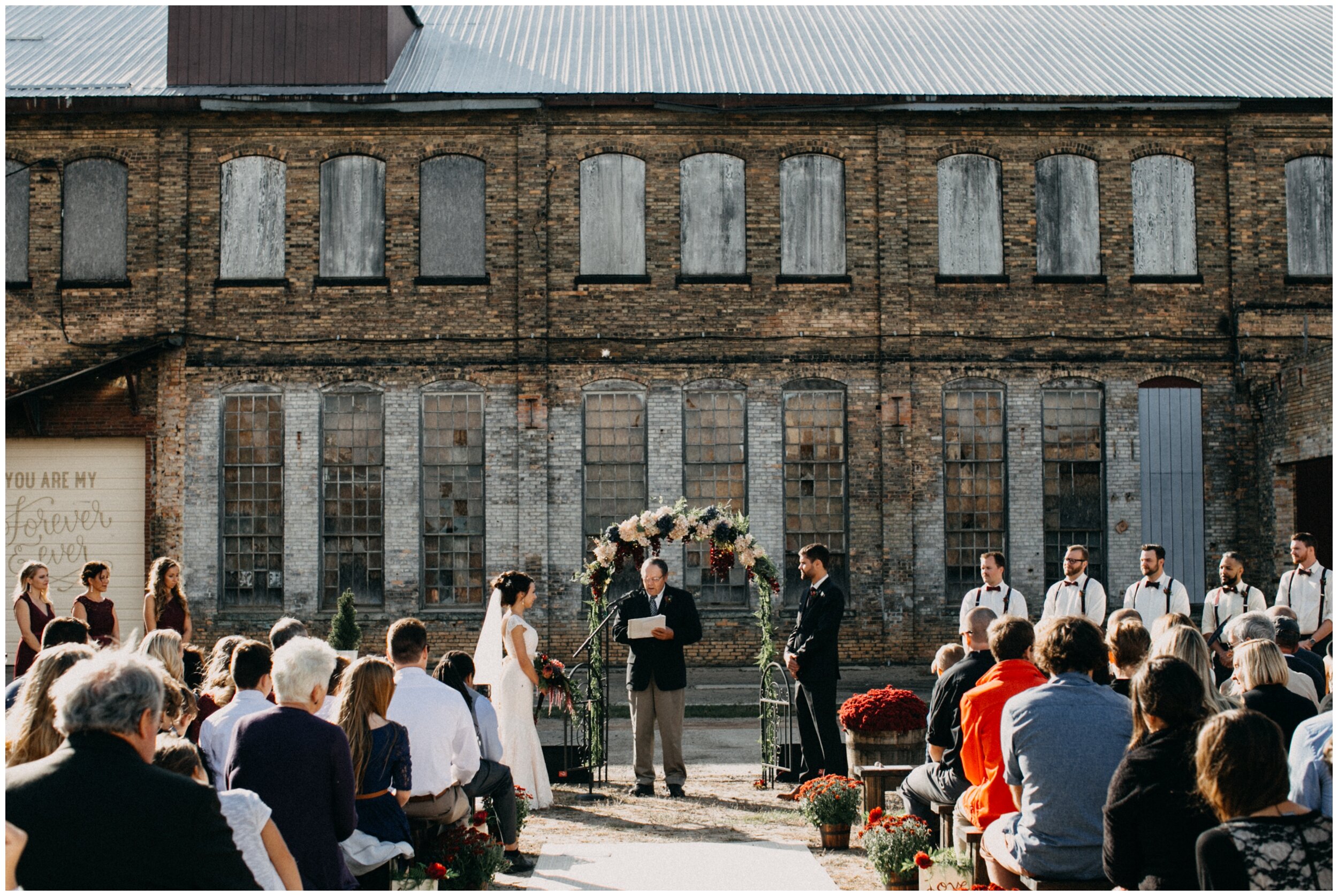 Industrial warehouse wedding ceremony at the Northern Pacific Center in Brainerd, Minnesota