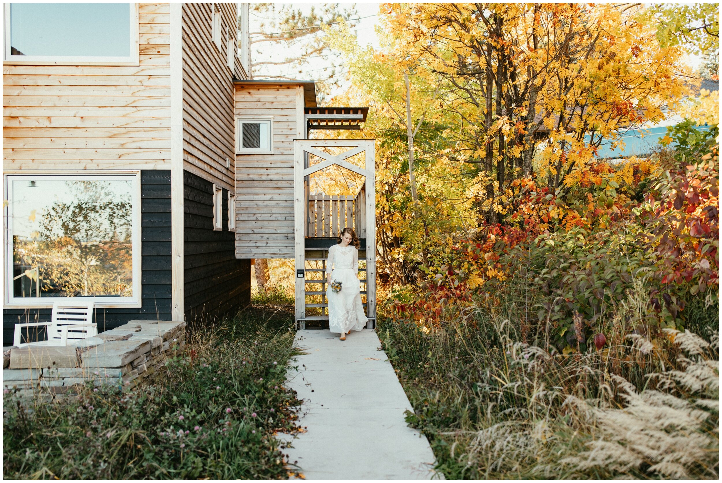 Bride walking to first look with groom on October wedding day in Grand Marias, Minnesota
