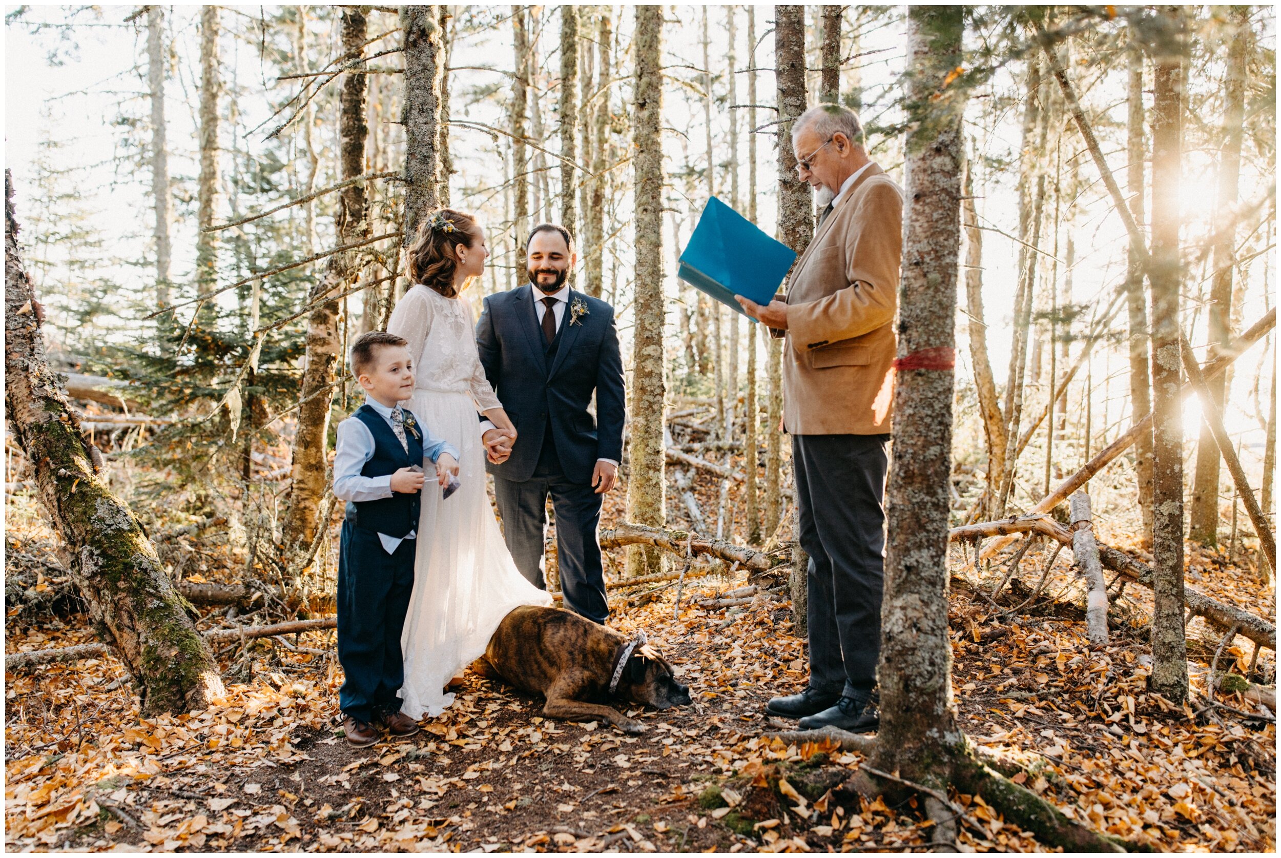 Intimate wedding ceremony in the woods on Artists' Point during sunset in Grand Marais, Minnesota