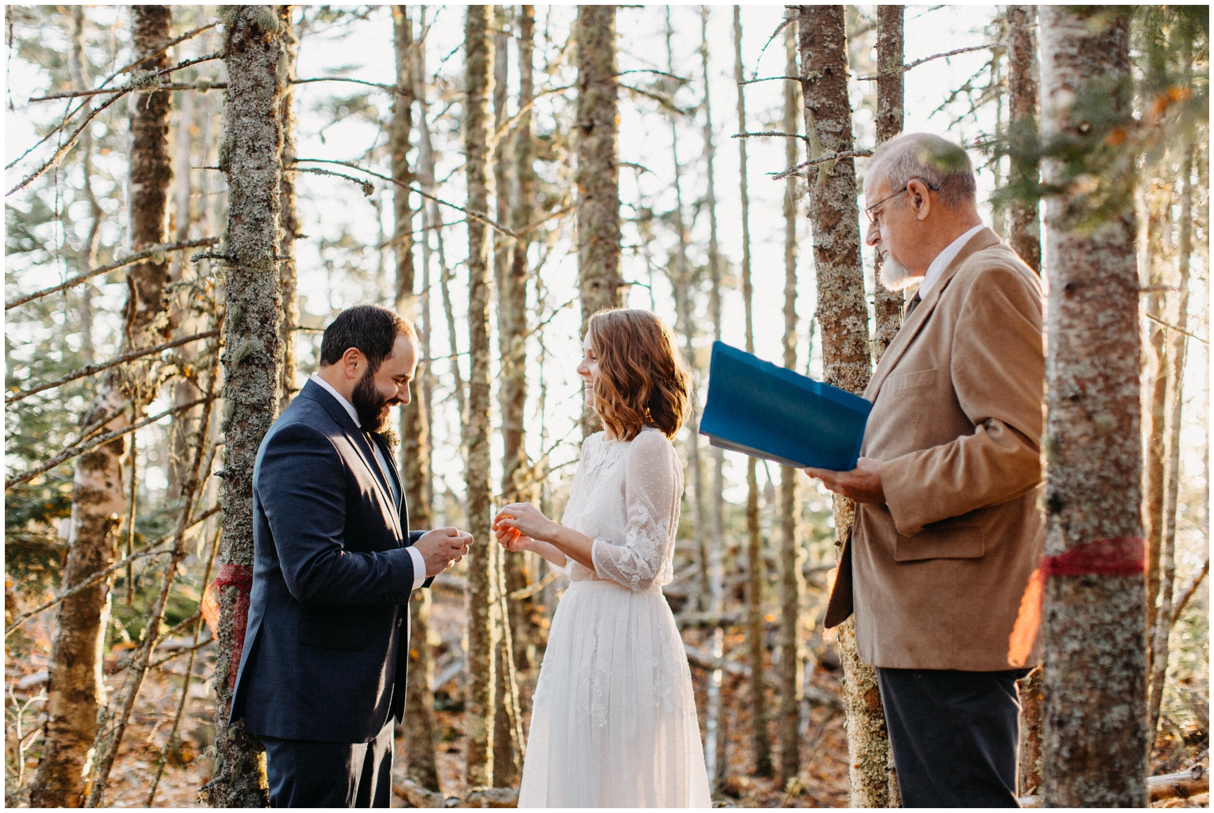 Intimate wedding ceremony in the woods on Artist Point in Grand Marais, Minnesota during sunset
