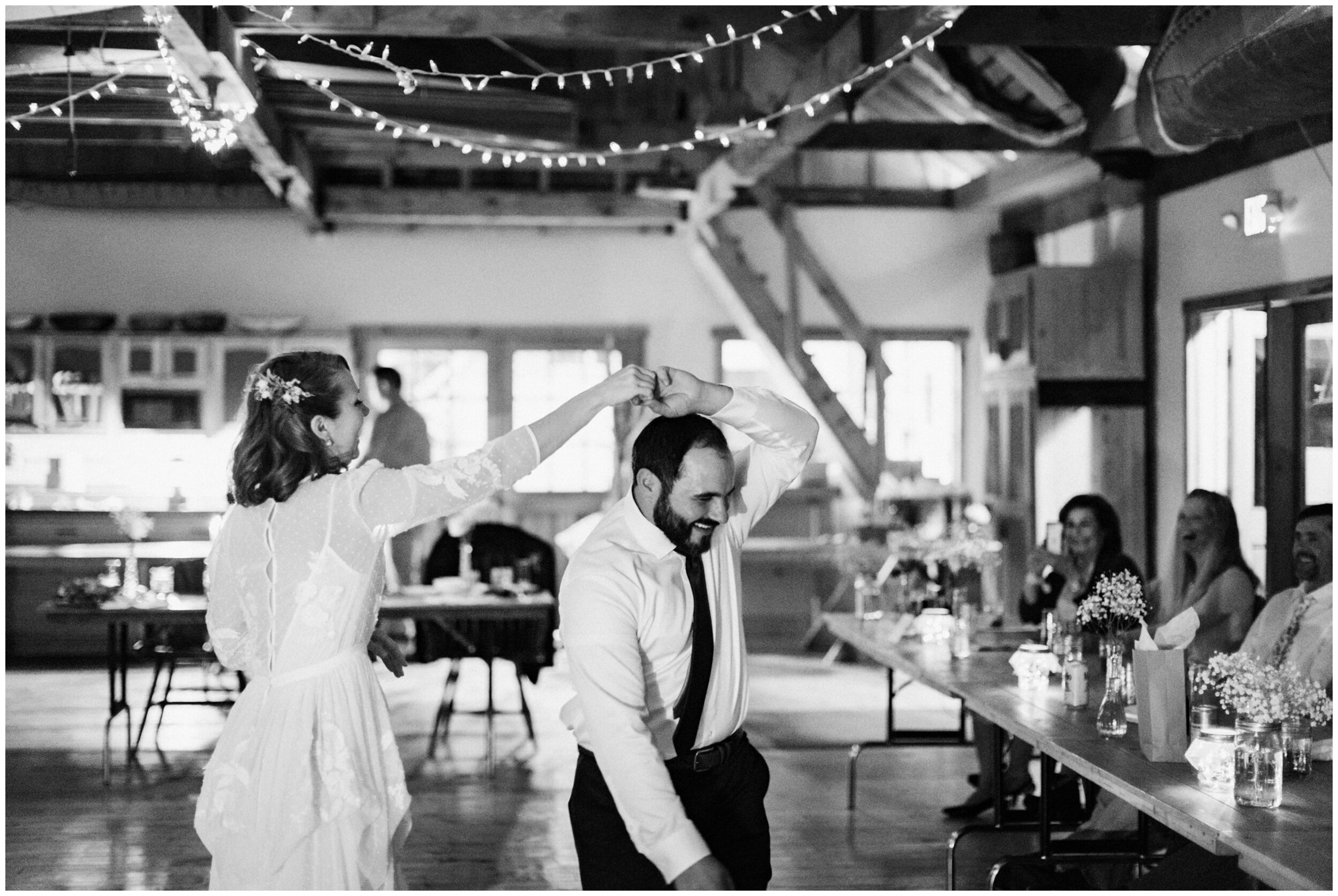 Bride and groom dancing during wedding reception at the North House Folk School in Grand Marais, Minnesota