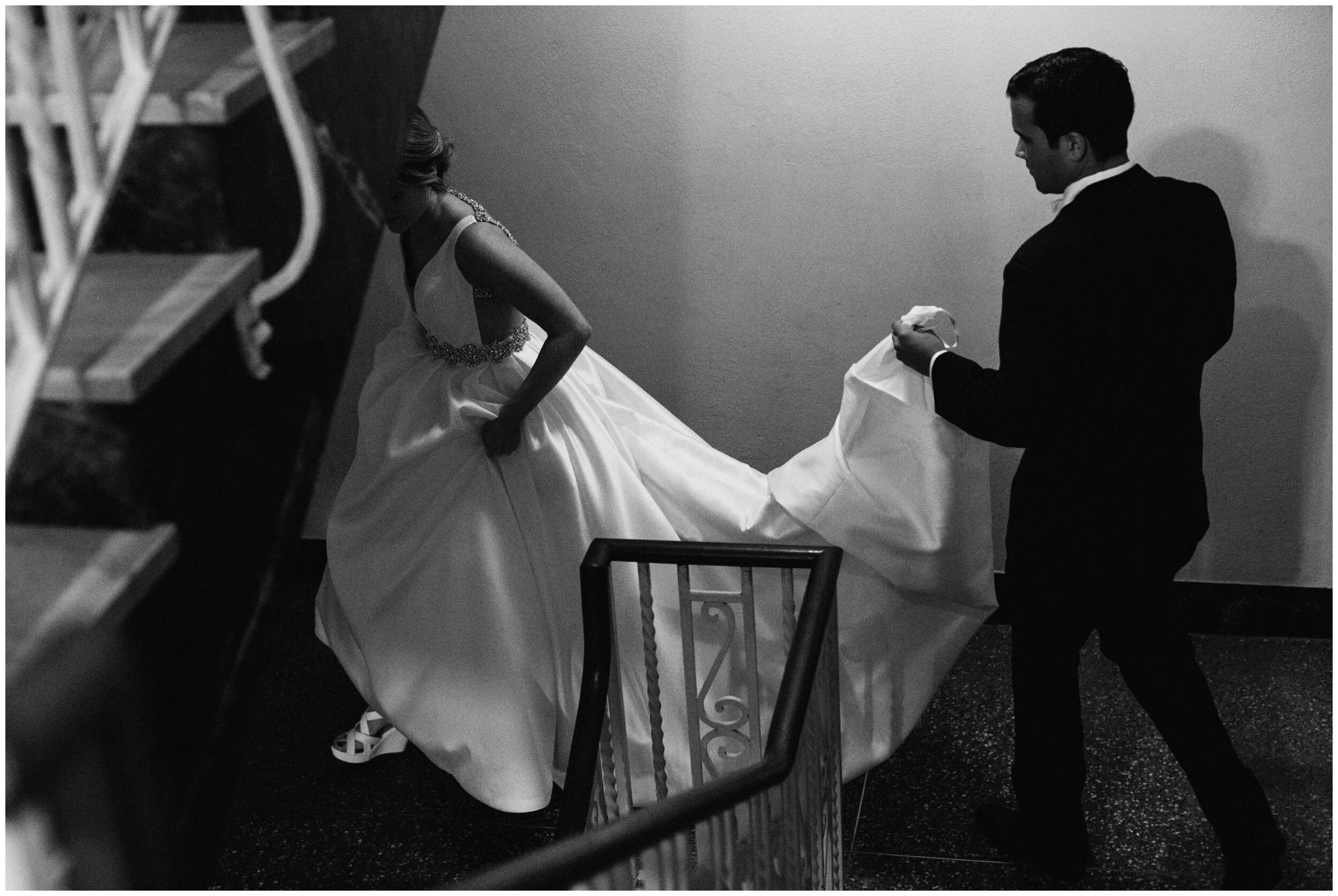 Bride and groom walking down the stairs at the Greysolon in Duluth Minnesota