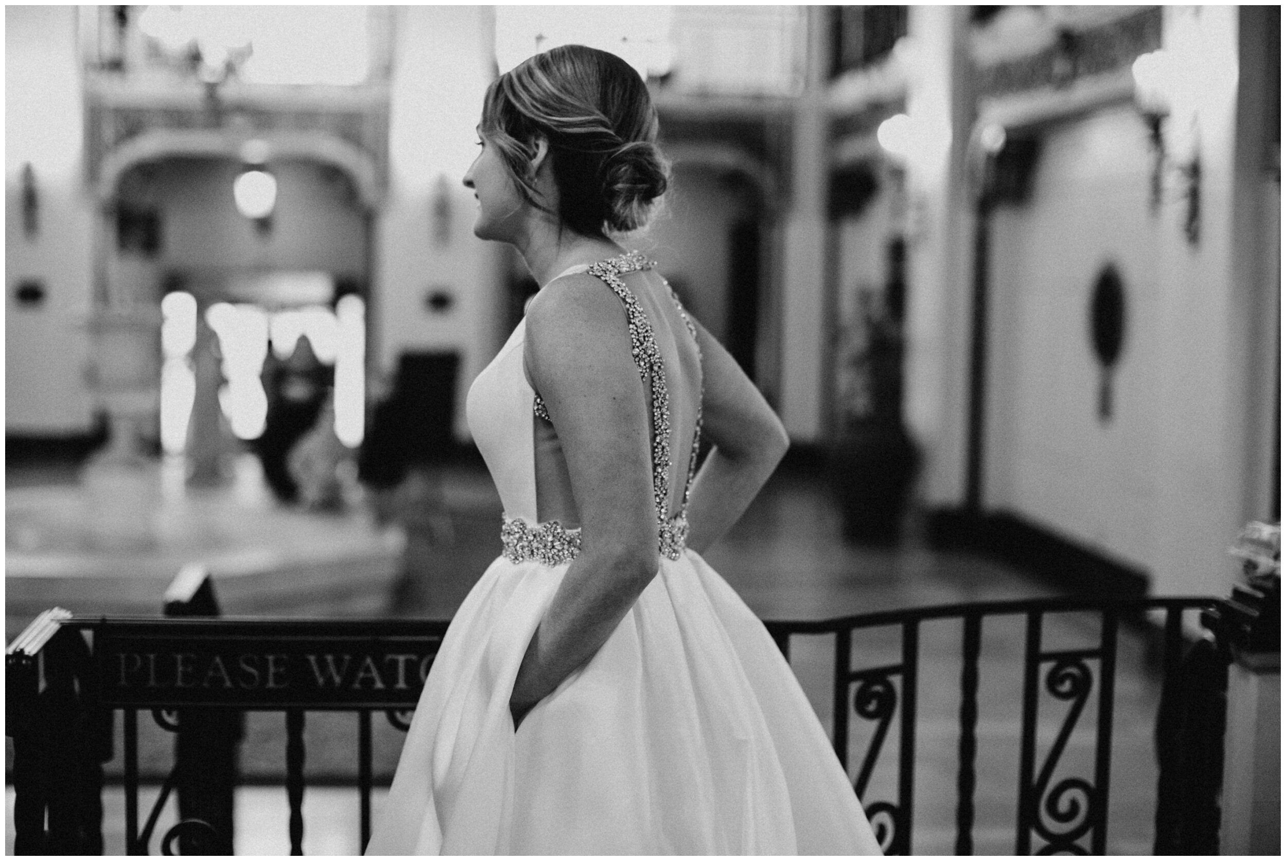 Bride wearing elegant, backless wedding gown at the Greysolon in Duluth